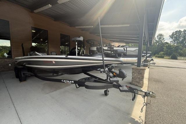 2023 Caymas CX 21 PRO boat parked under a shelter, showcasing sleek design and modern features.