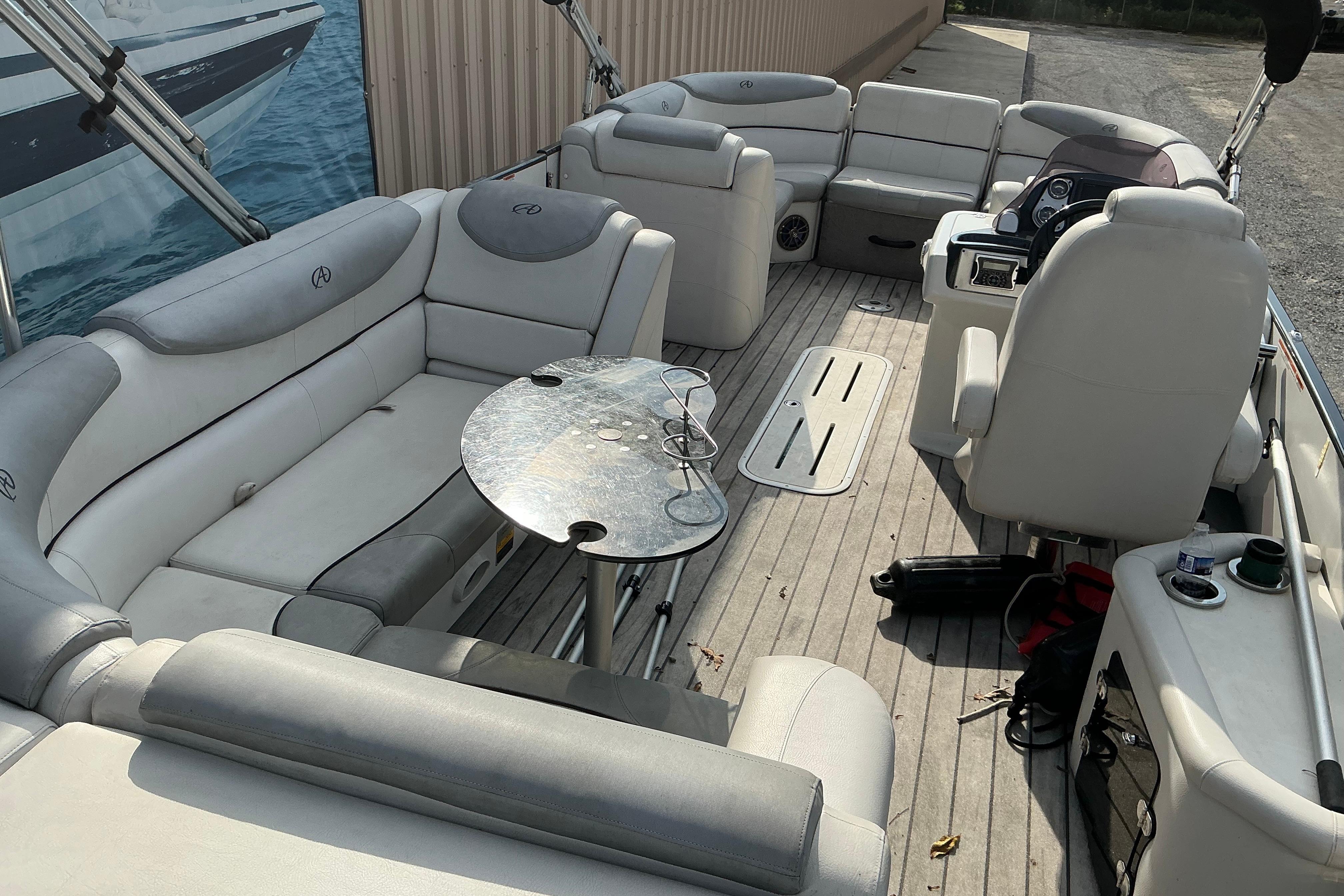 2014 Avalon 25 ft. Paradise Elite pontoon boat interior with plush seating and table.