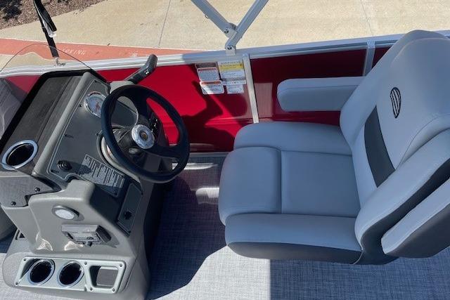 2026 Sun Tracker Party Barge 16 DLX interior with steering console and seating.