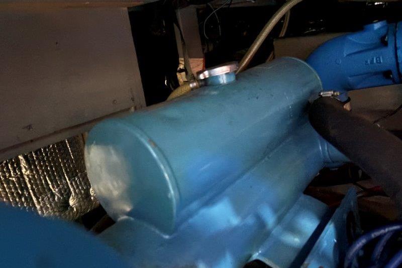 Engine compartment of 1987 Tollycraft 34 Sundeck Motor Yacht, featuring blue components.