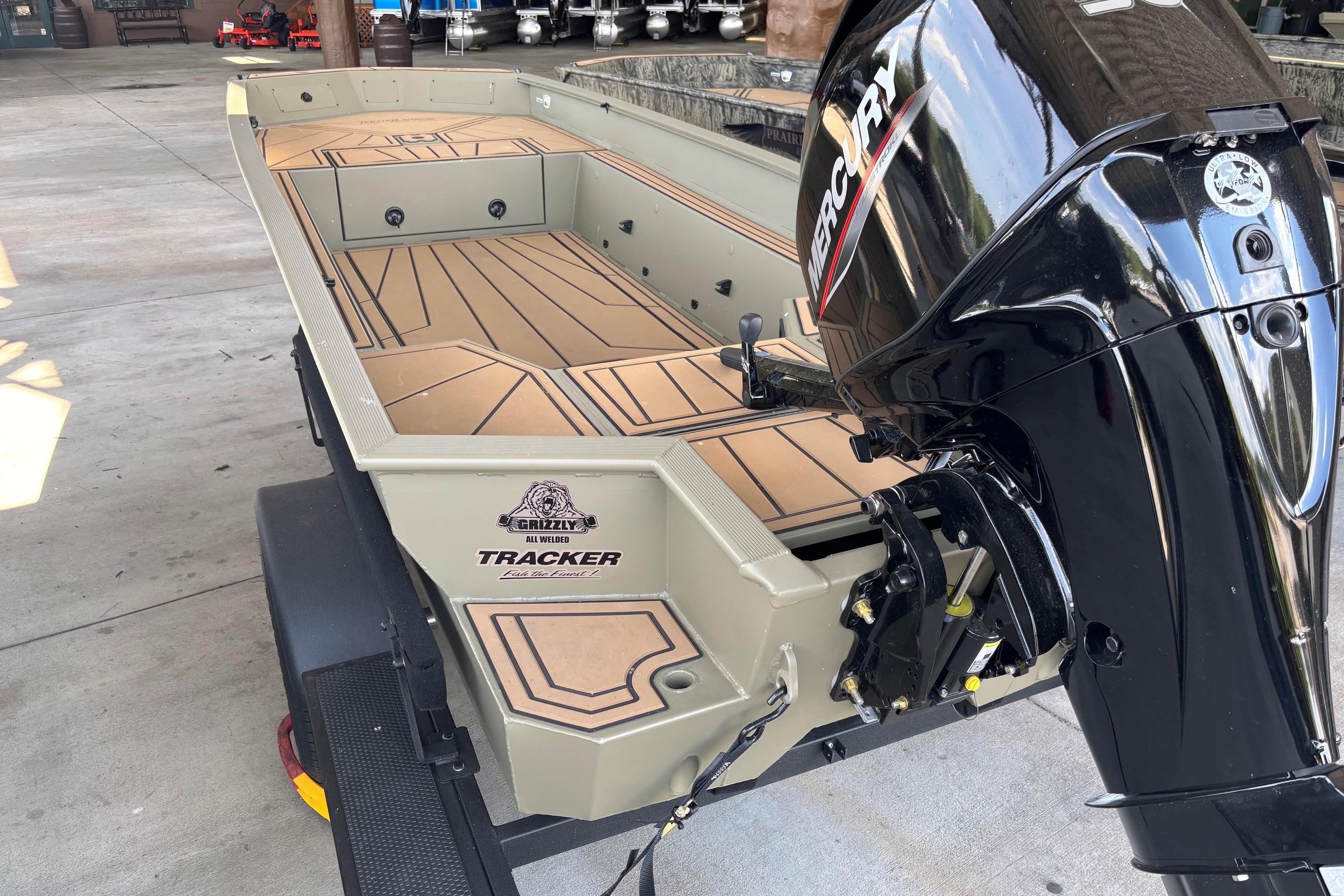 2026 Tracker Grizzly 1650 T Prairie Wings Edition boat with Mercury outboard motor.