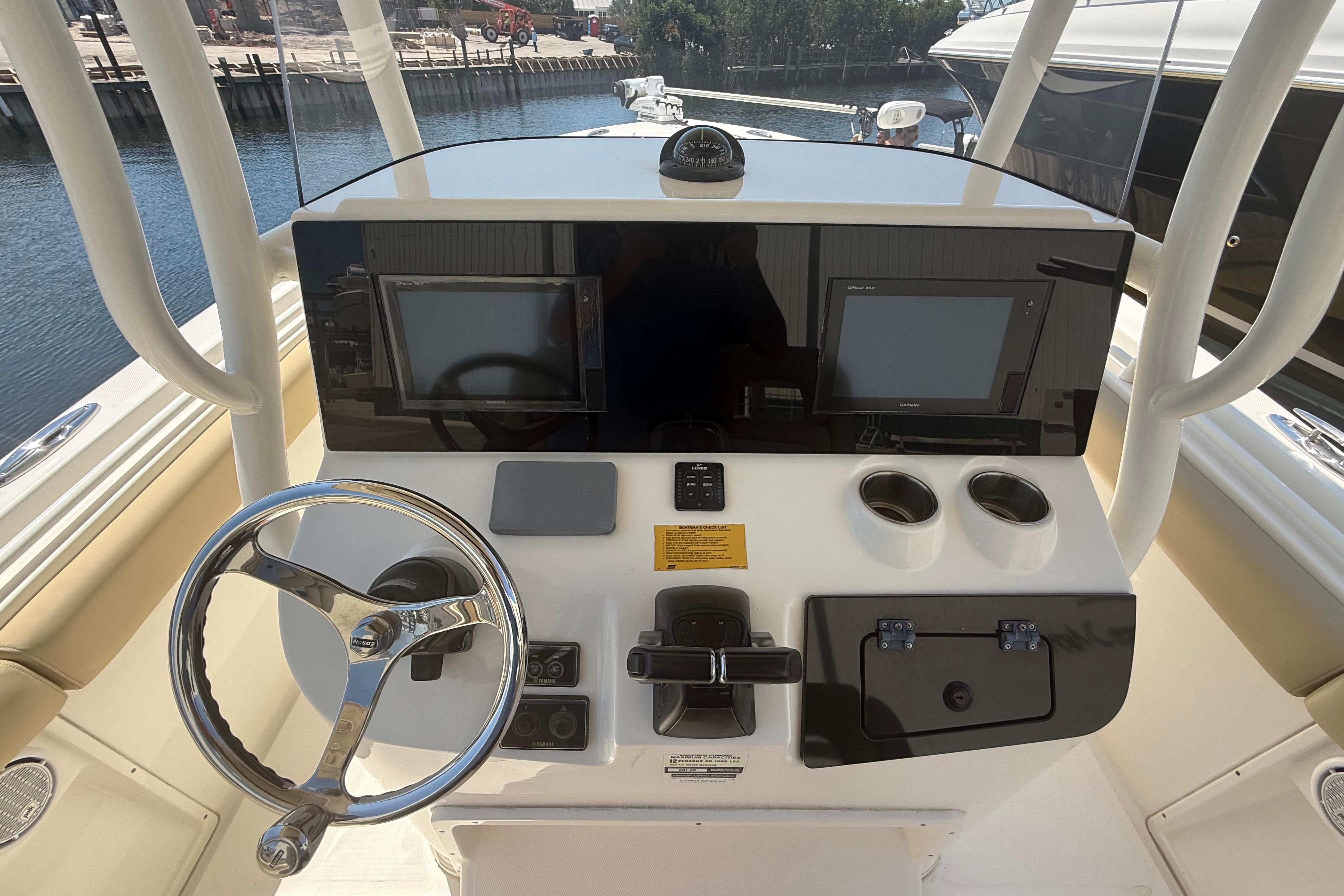 2019 Key West Billistic 281 Center Console helm with steering wheel and dual displays.