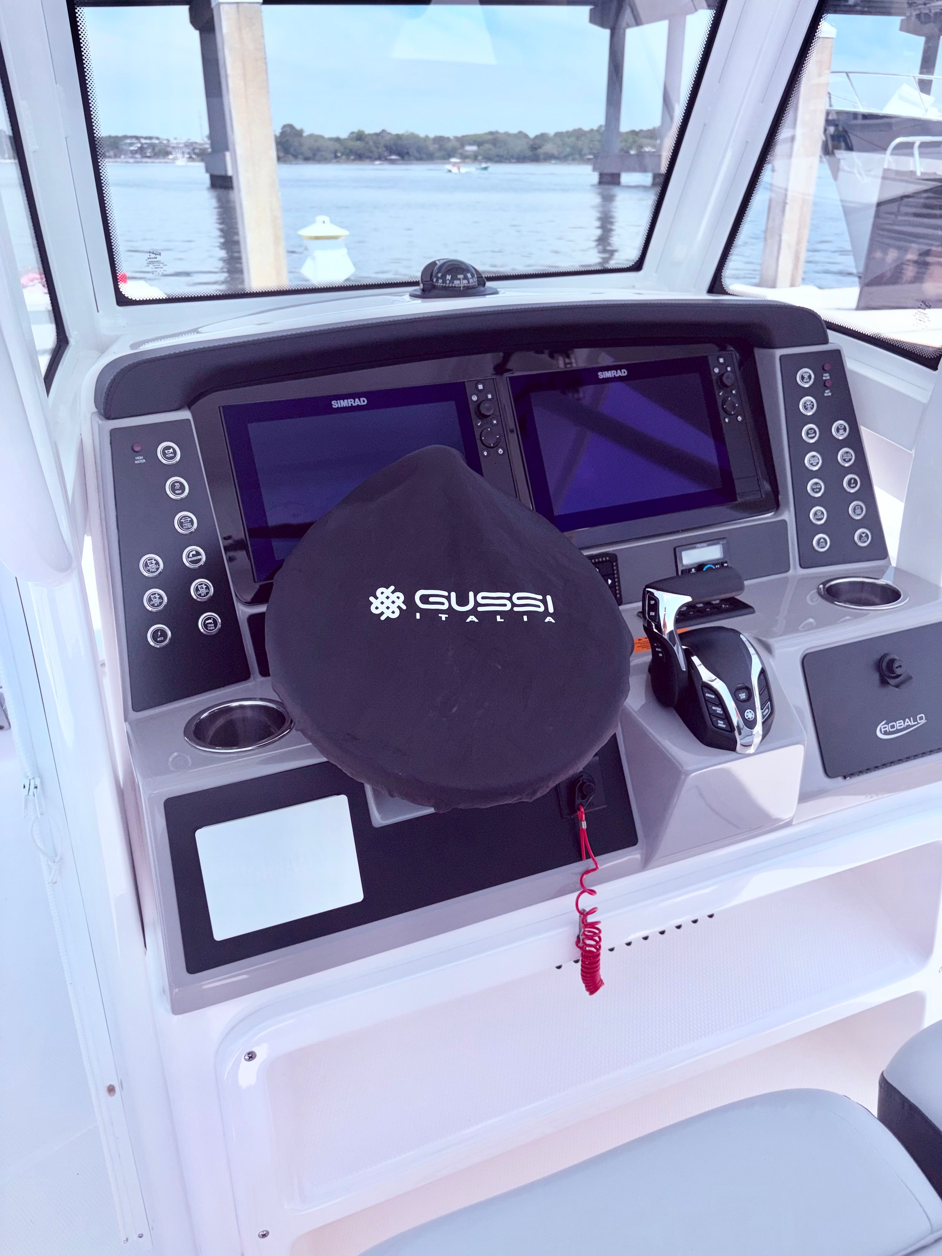 2025 Robalo 266 Cayman helm with Gussi steering wheel.
