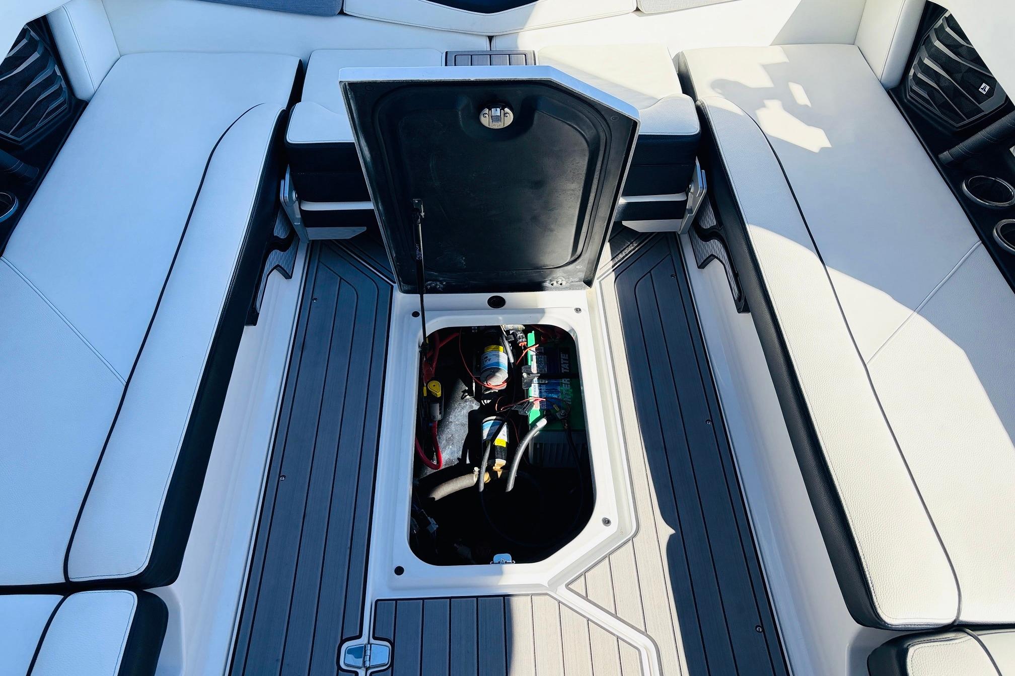 2023 Nautique Super Air Nautique G25 interior with open storage compartment.