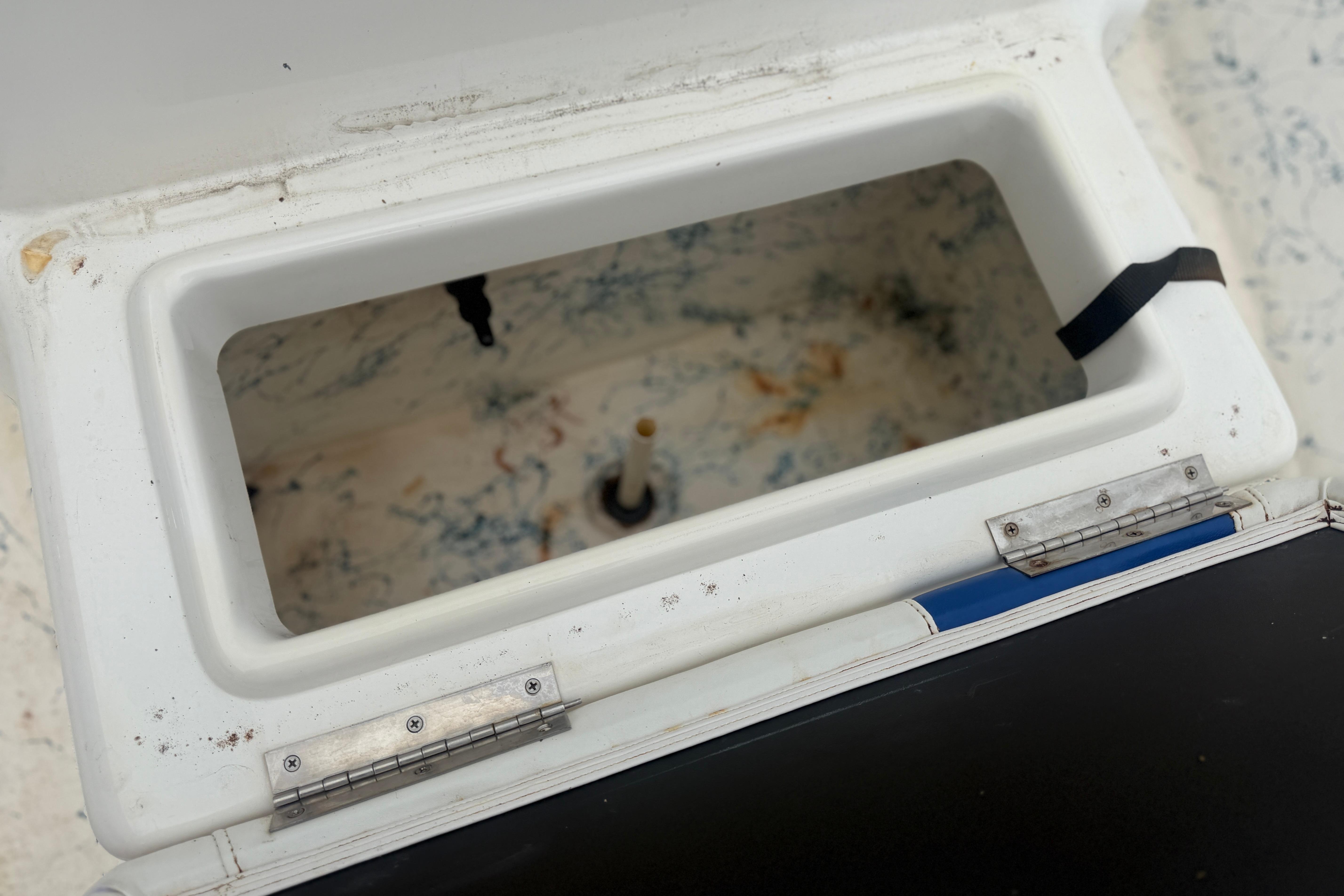 Open storage compartment on a 2004 Blue Wave 160 V-Bay boat.