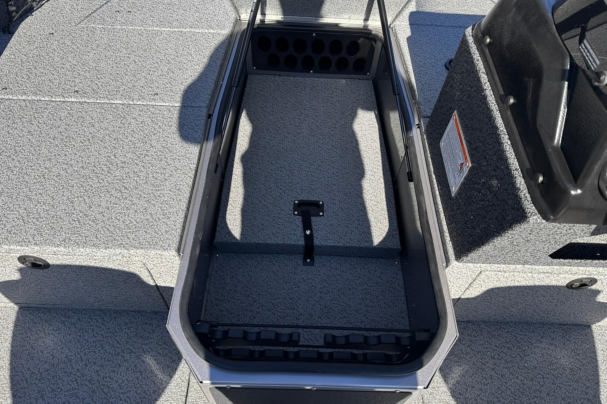 2026 Lund 1875 Impact XS SS boat interior storage compartment, featuring durable design and ample space.