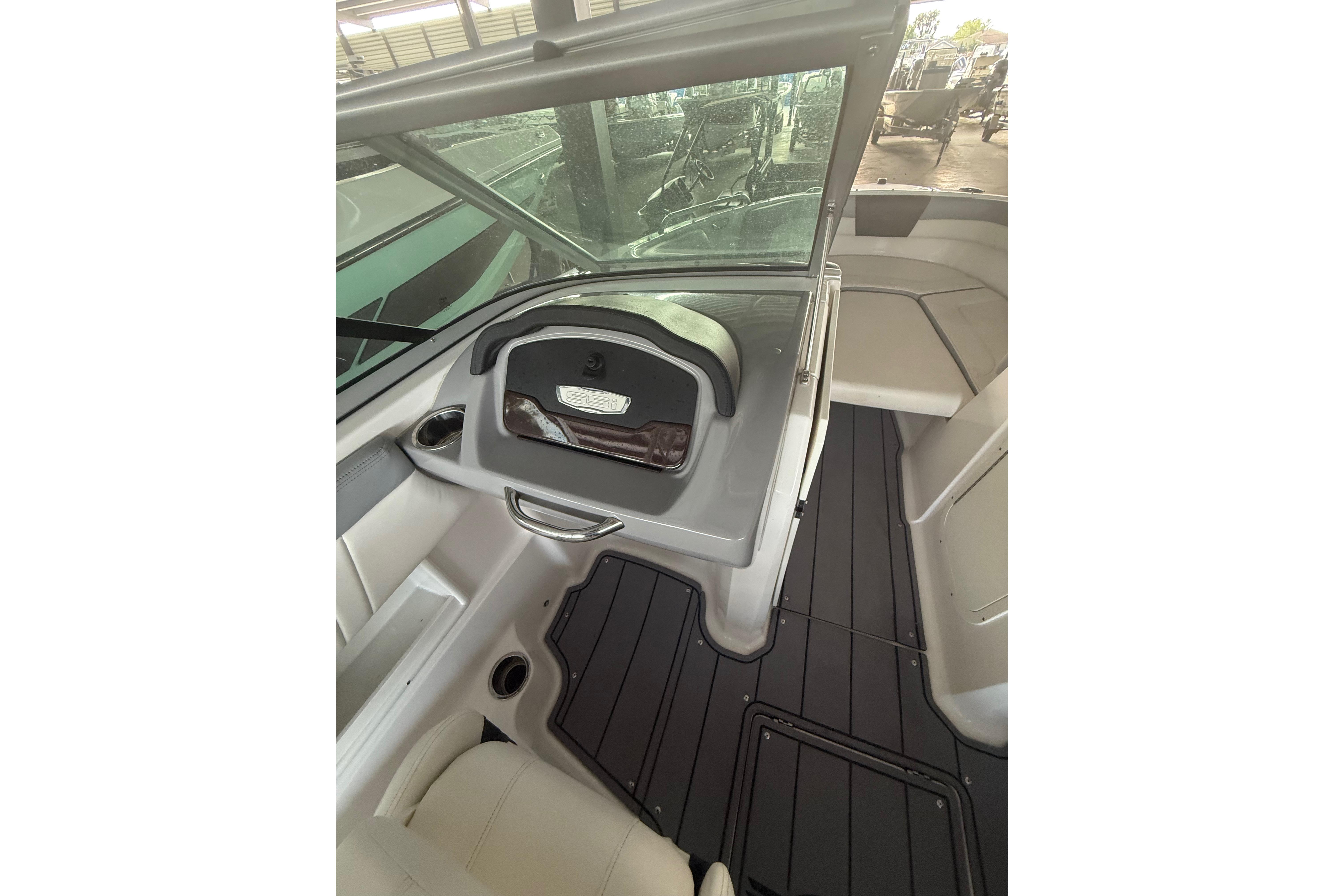 2023 Chaparral 230 SSi boat interior with sleek seating and modern dashboard design.
