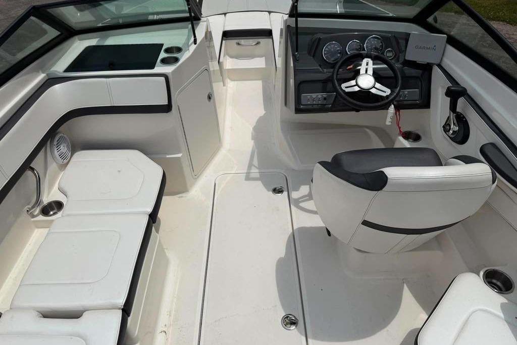 Interior of a 2016 Sea Ray 21 SPX boat, featuring sleek seating and modern controls.