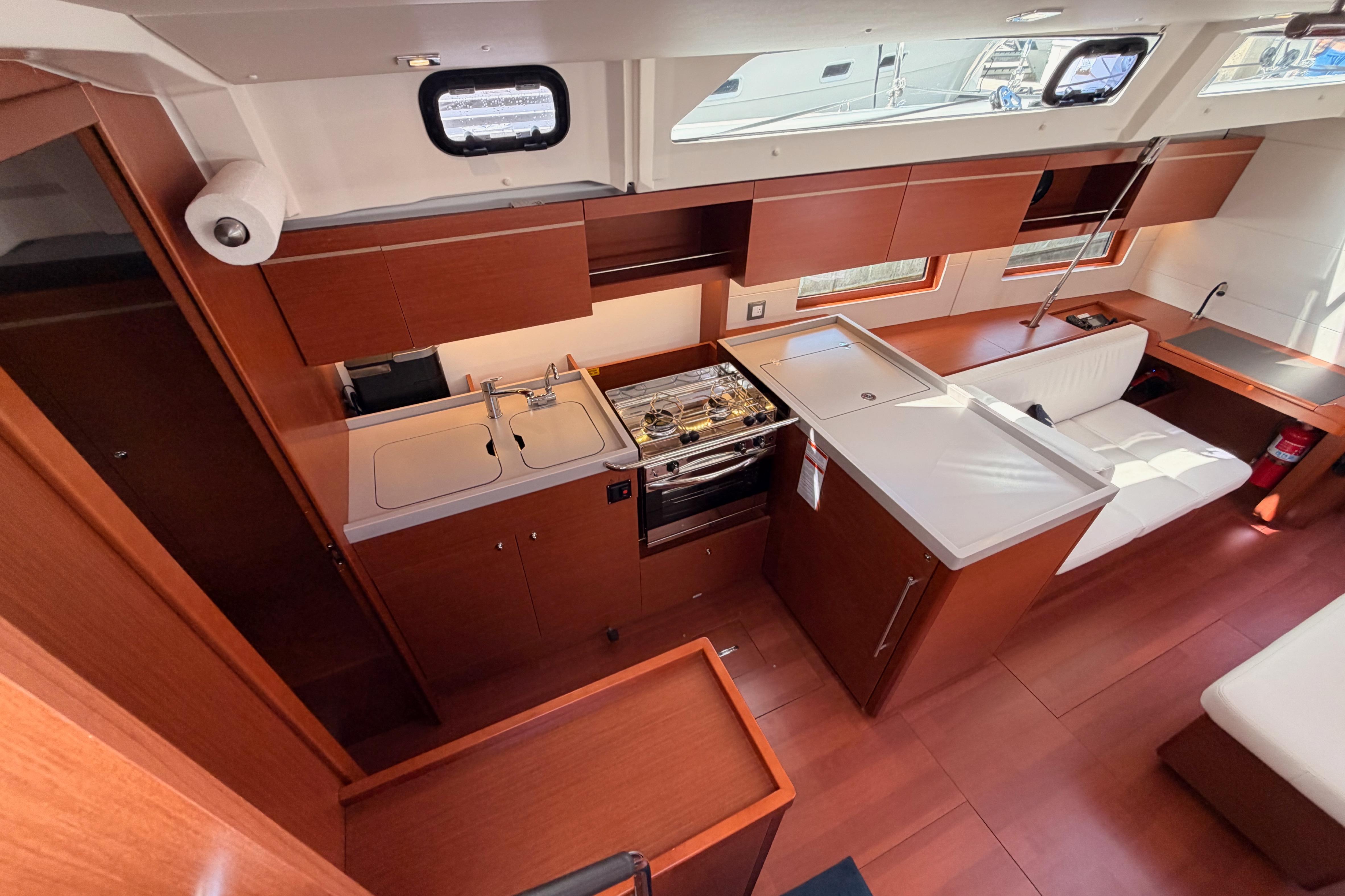 Interior of 2020 Beneteau Oceanis 46.1 yacht, featuring modern kitchen and seating area.
