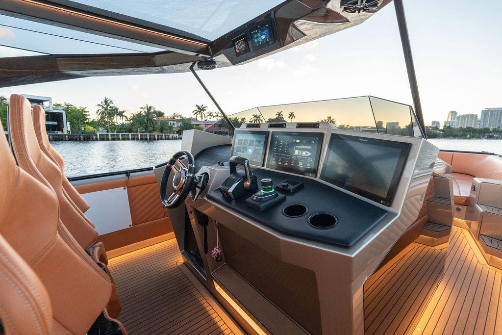 Luxurious 2023 DeKoning 43 yacht interior with advanced navigation system and leather seating.