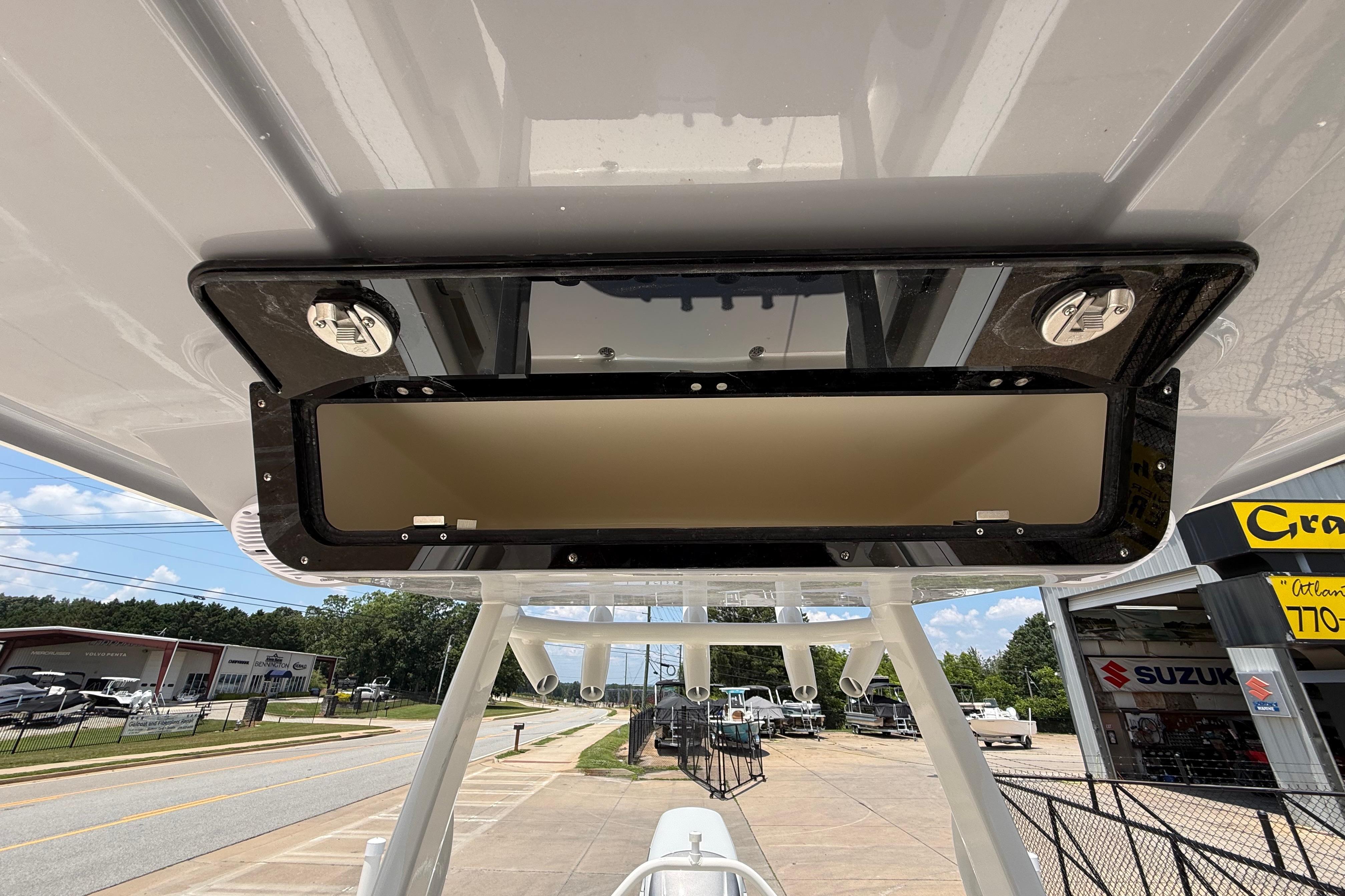 2027 Key West 249 FS boat console with storage compartment, outdoor dealership setting.