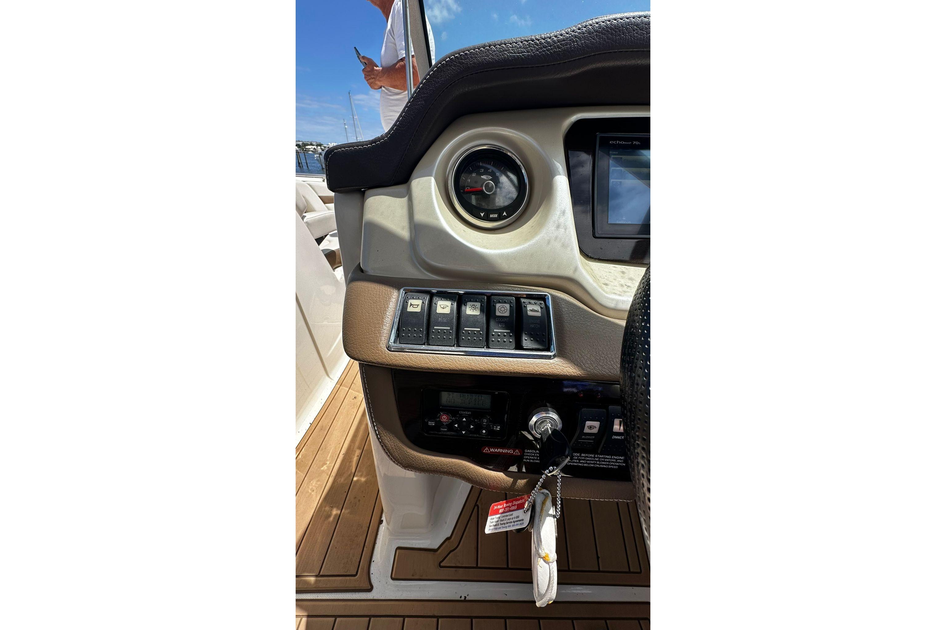 Dashboard of a 2015 Chaparral 264 Sunesta boat with controls and gauges.