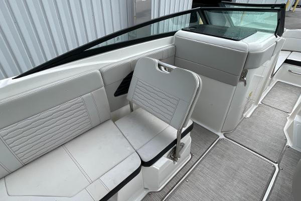 2023 Sea Ray SPX 230 boat interior with white seating and modern design.