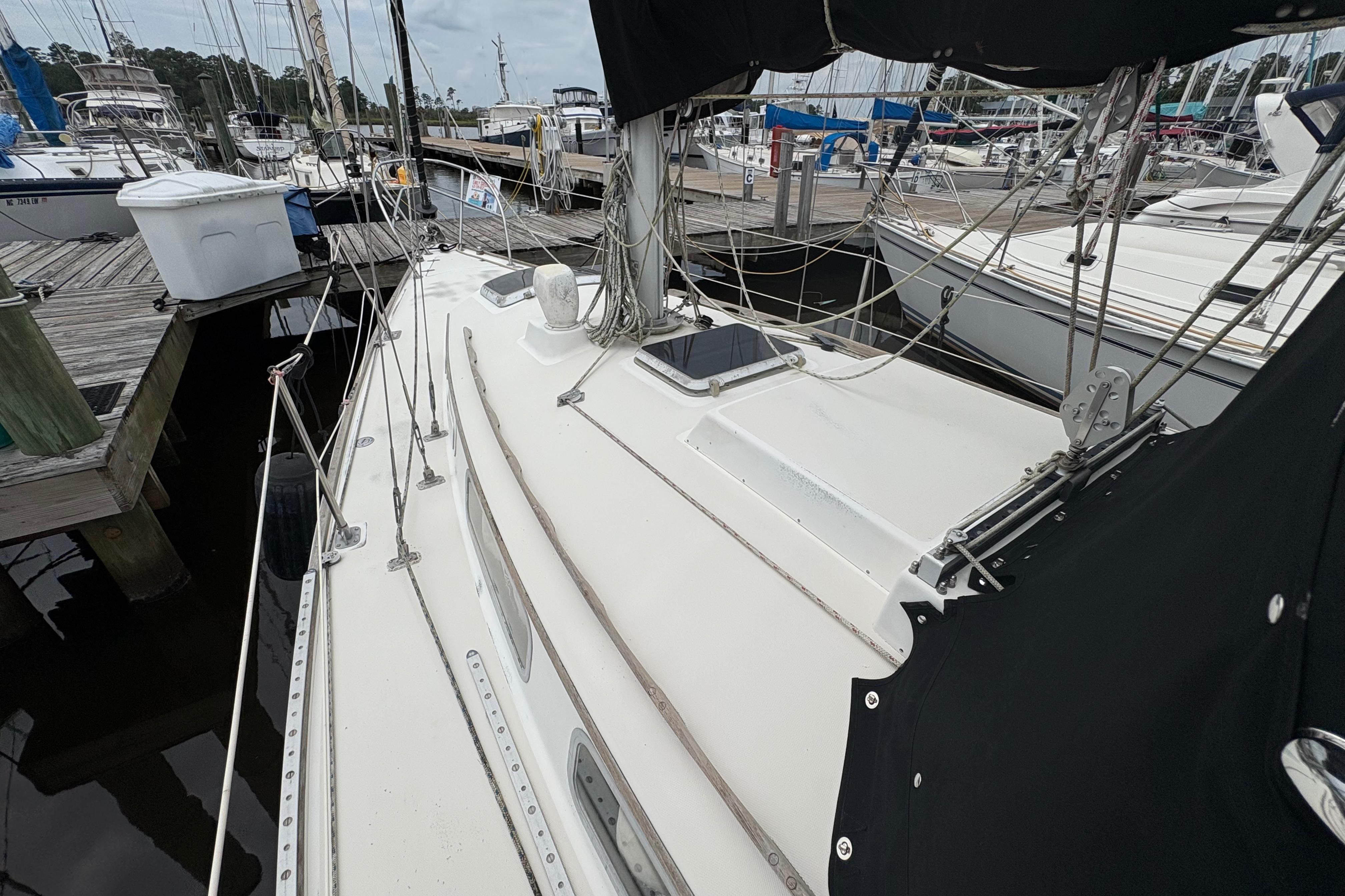 1981 Sabre 31 sailboat docked at marina, showcasing deck and rigging.