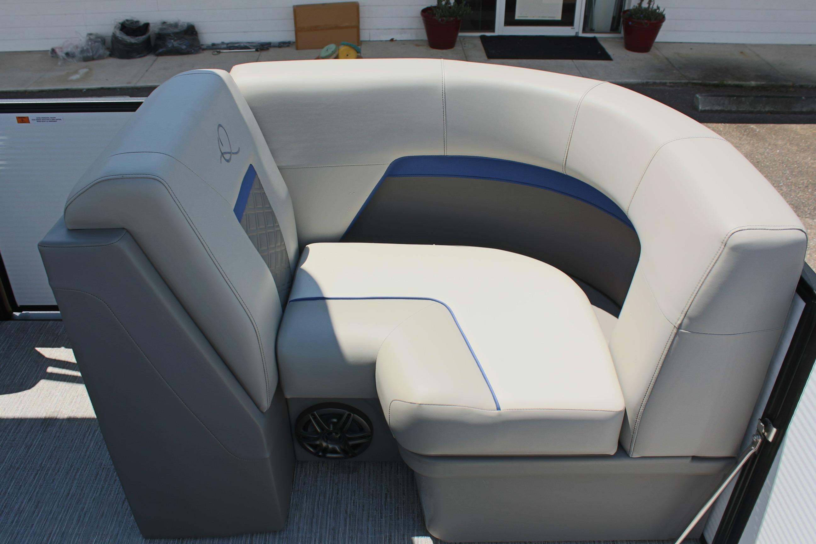 Luxurious seating on 2026 Qwest Lanai 816 pontoon boat, featuring modern design and comfort.