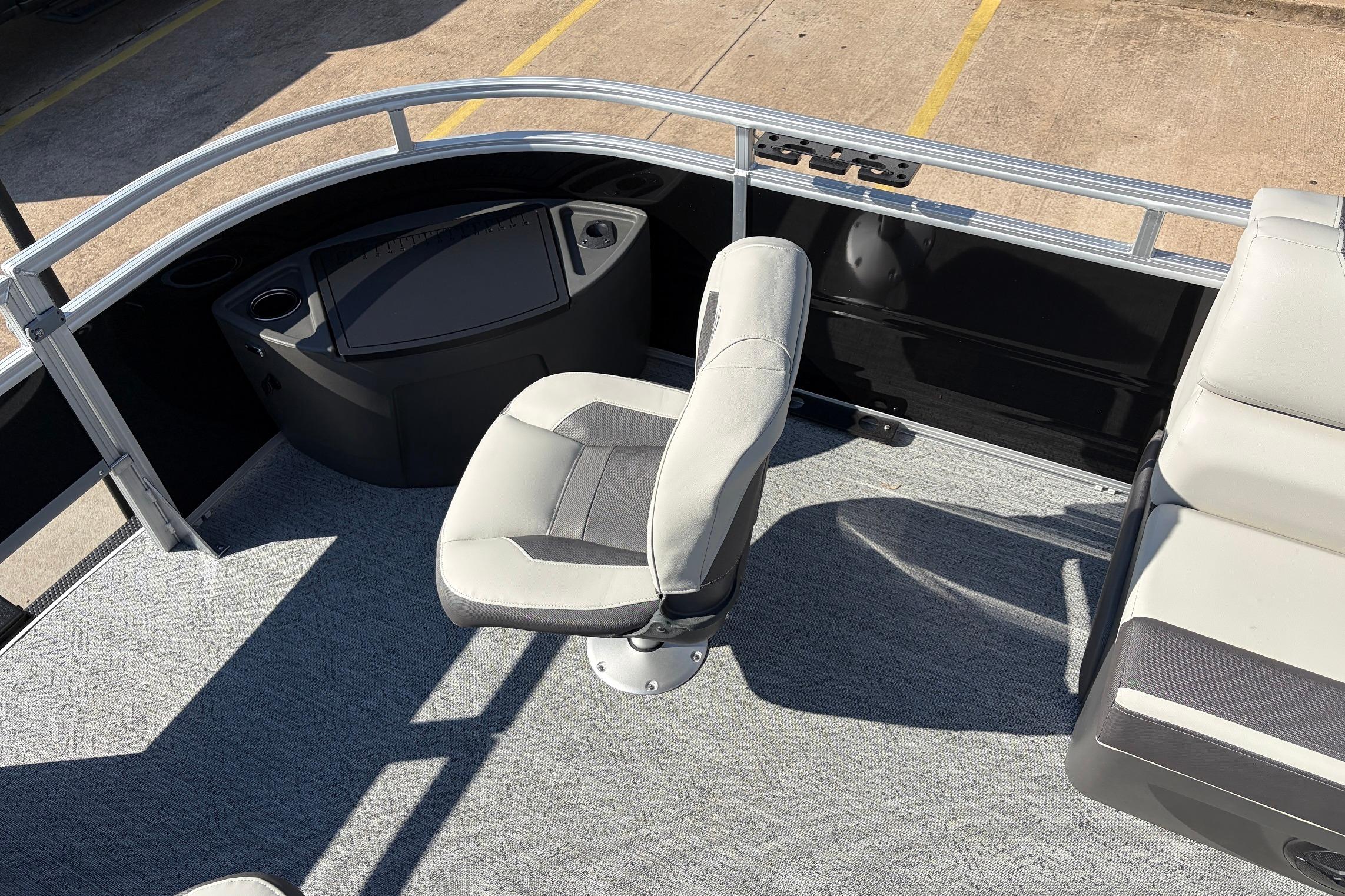 2026 Sun Tracker Fishin' Barge 22 XP3 interior with seating and console.