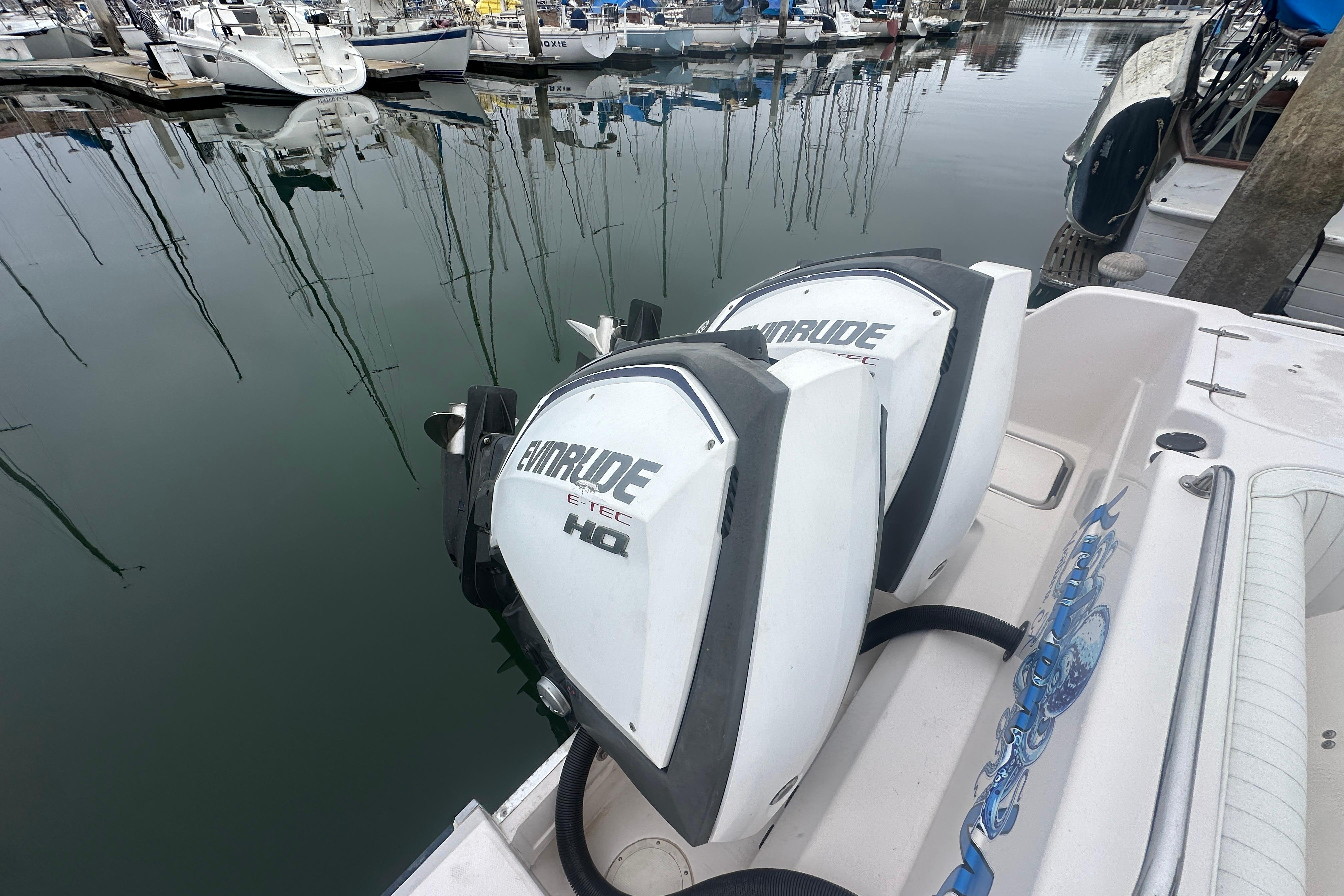 2001 Grady-White Marlin 300 with Evinrude E-TEC engines docked in a marina.