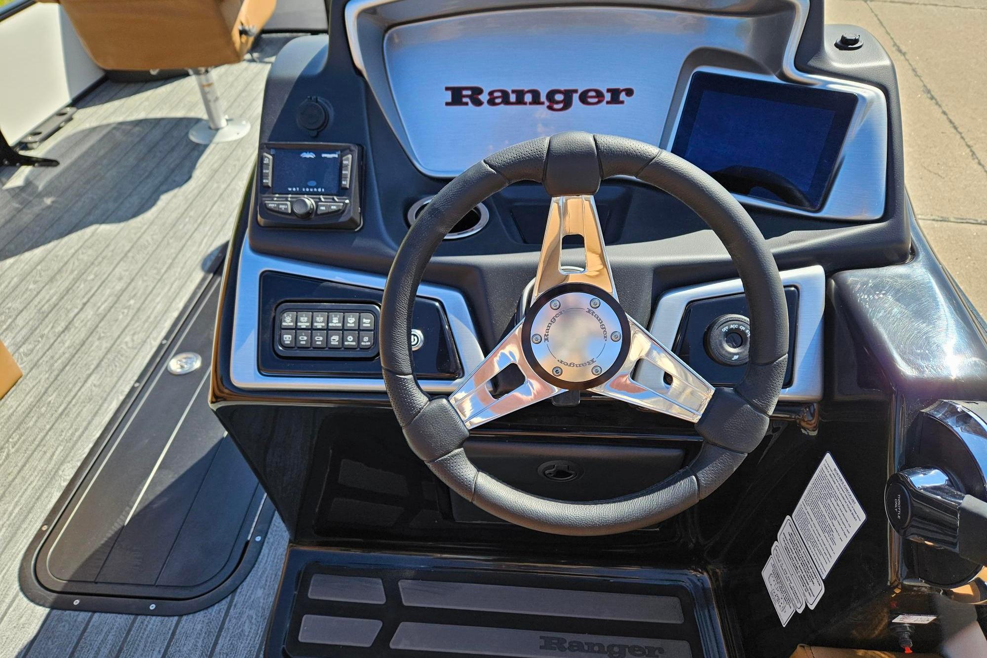 Steering console of 2026 Ranger 223F boat with modern controls and sleek design.