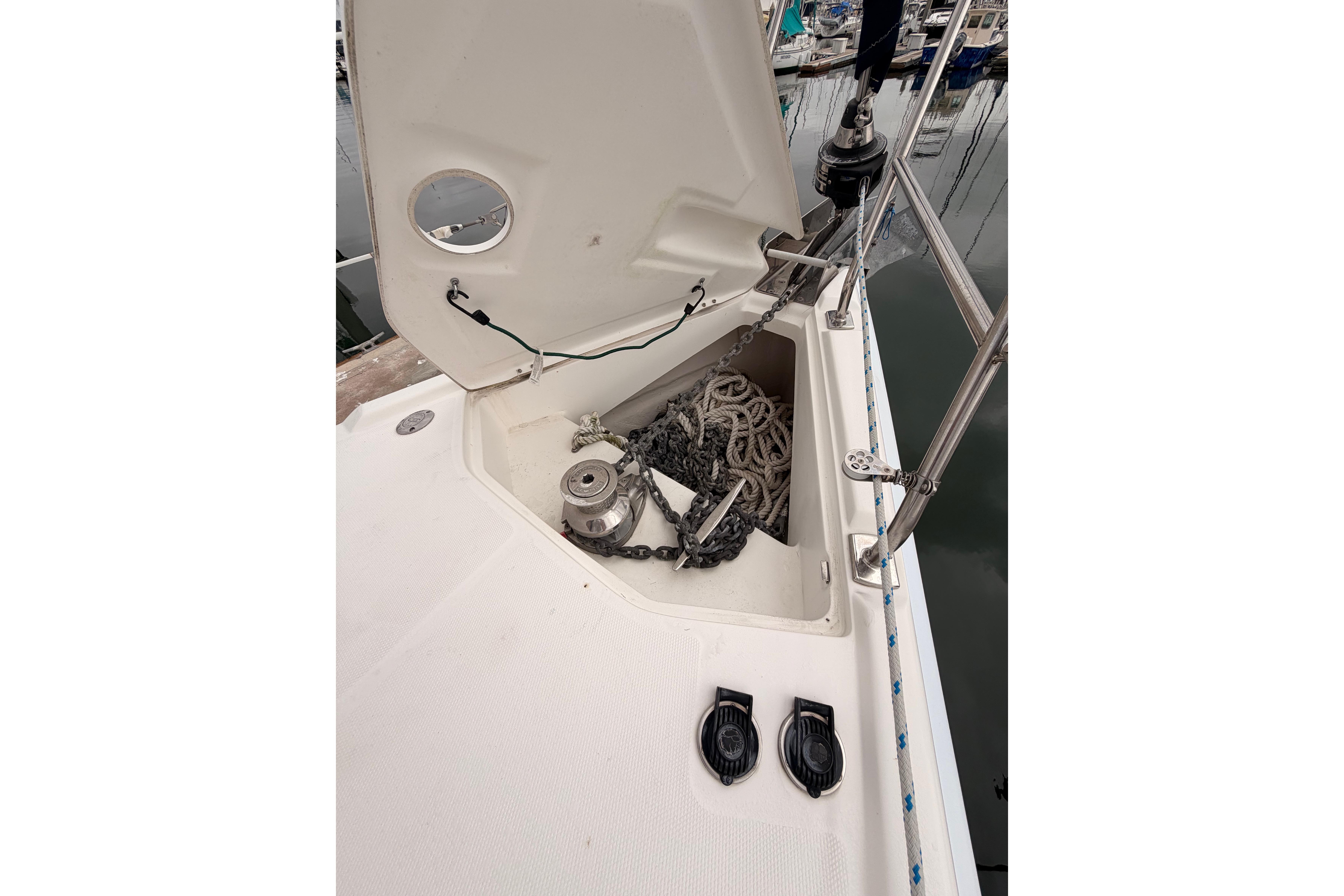 Anchor locker of 2009 Hunter 38 sailboat with chain and rope storage.