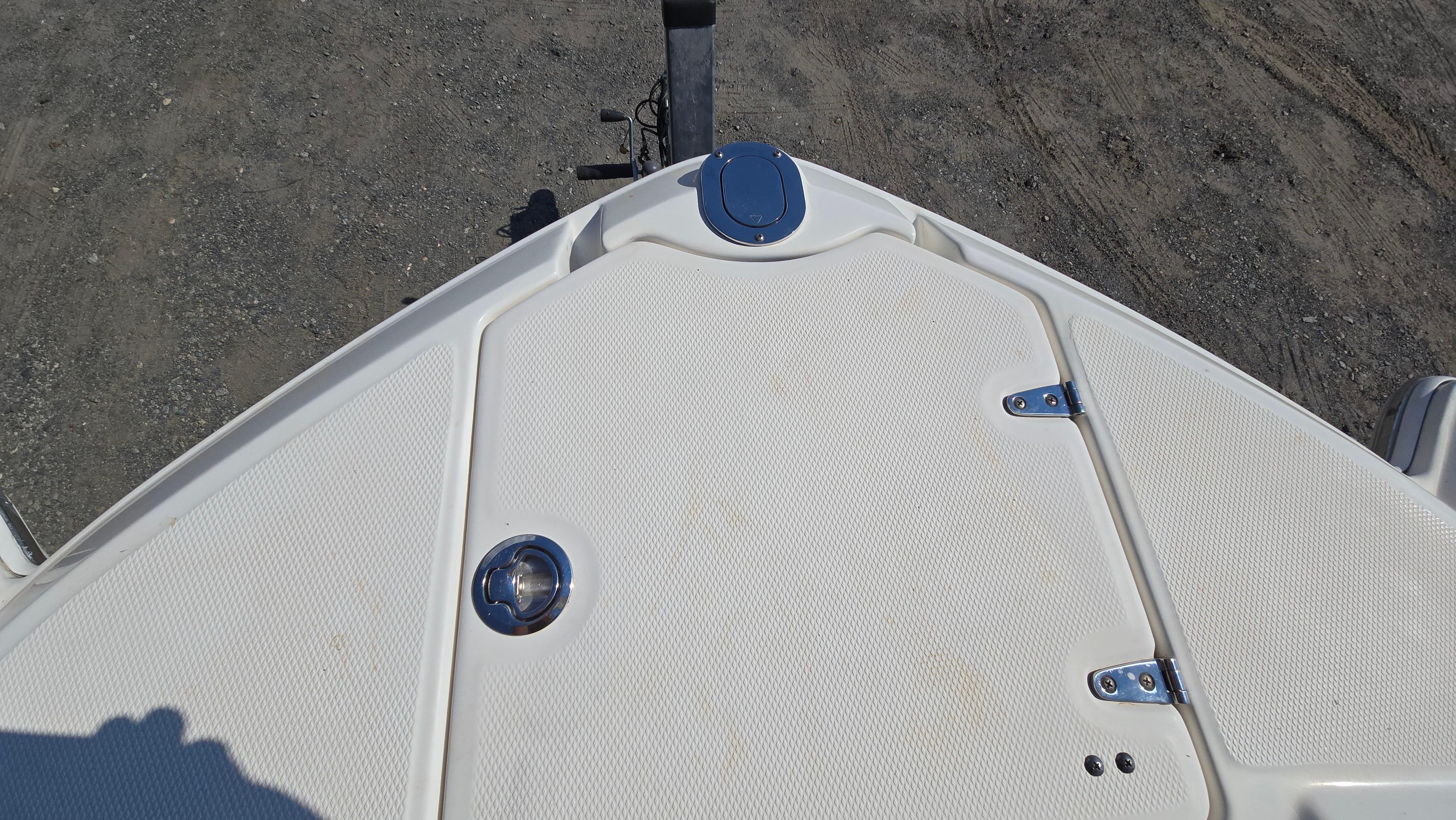 Bow of 2018 Chaparral 224 Sunesta boat with white textured surface.