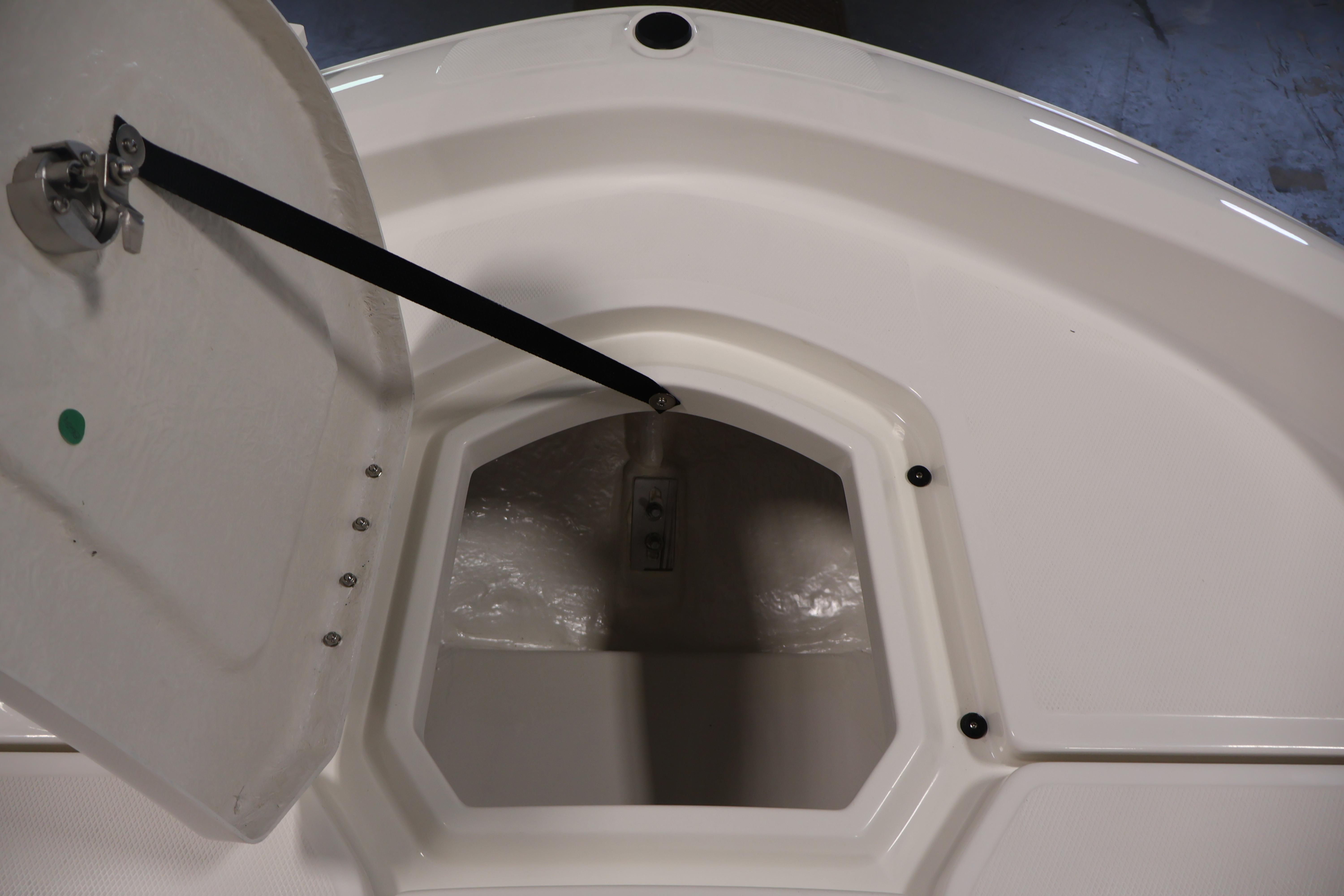 Open storage compartment on 2026 Bayliner Trophy T18 boat.