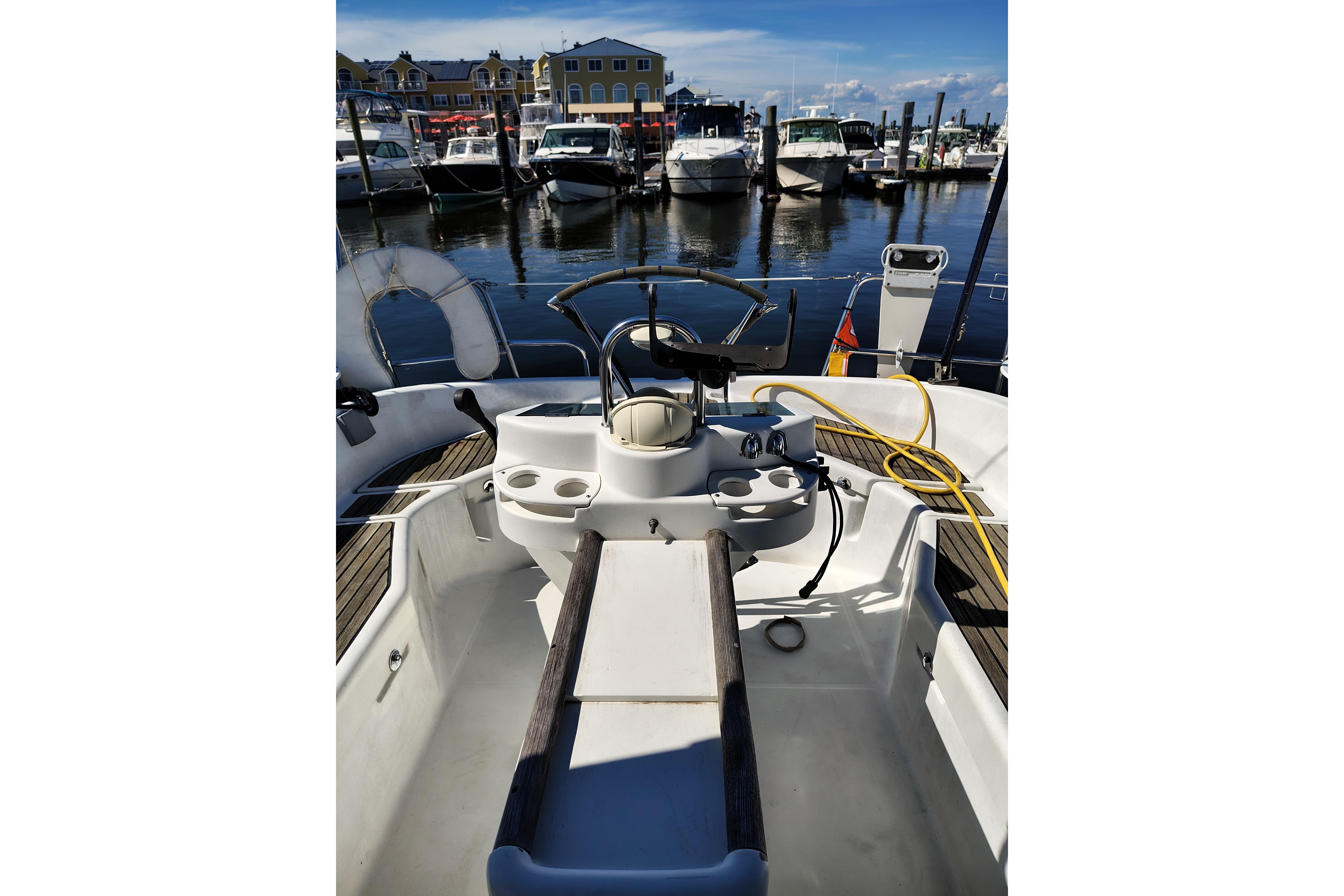 Cockpit view of 2001 Beneteau Oceanis 411 sailboat docked at marina.