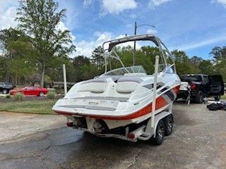 2008 Yamaha AR230 boat parked outdoors on a trailer.