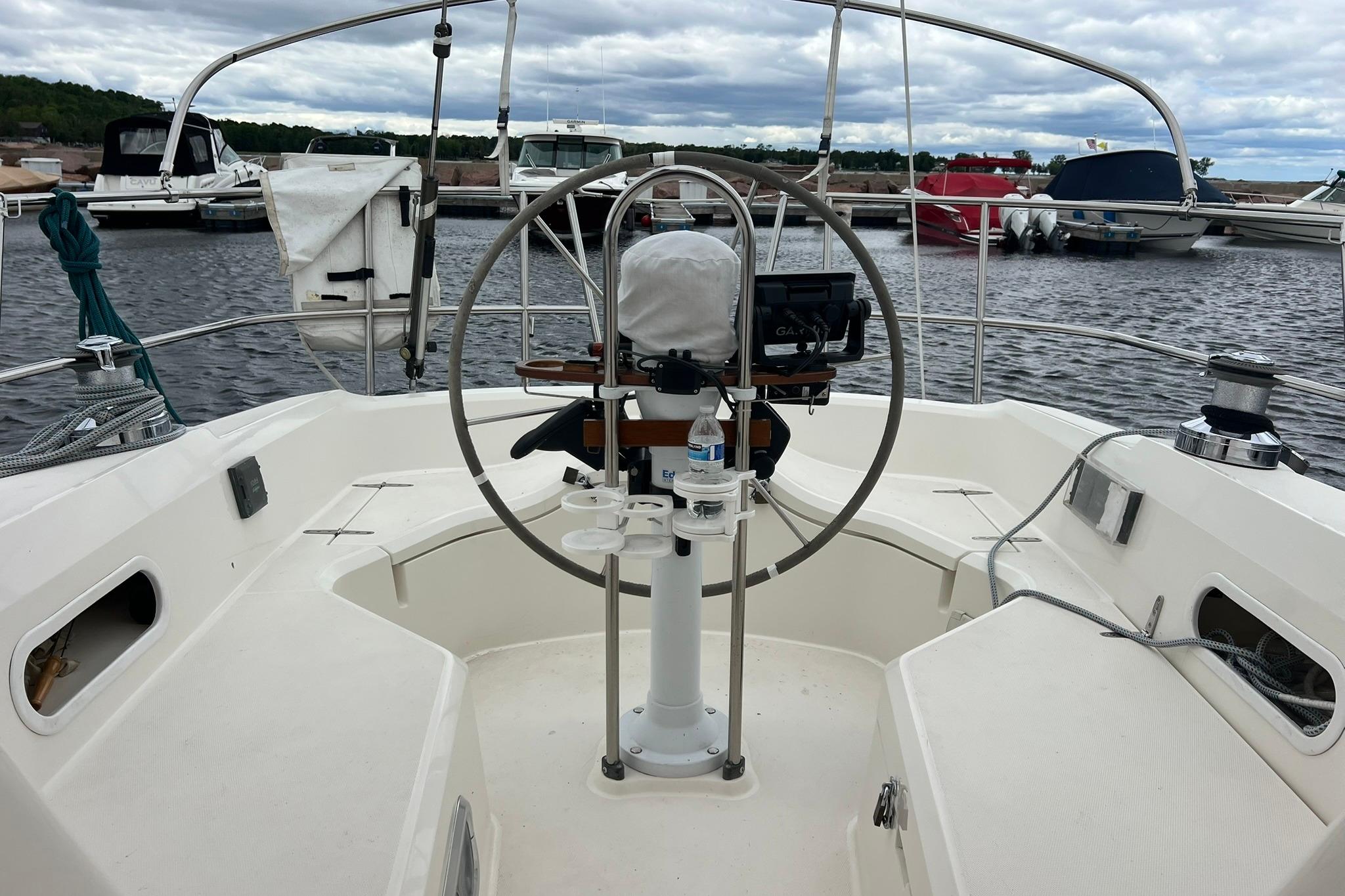 Cockpit view of a 1998 Sabre 362 sailboat docked at a marina.