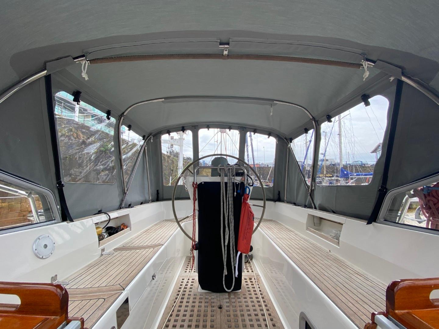 Interior view of 2002 Najad 490 sailboat cockpit with covered seating area.