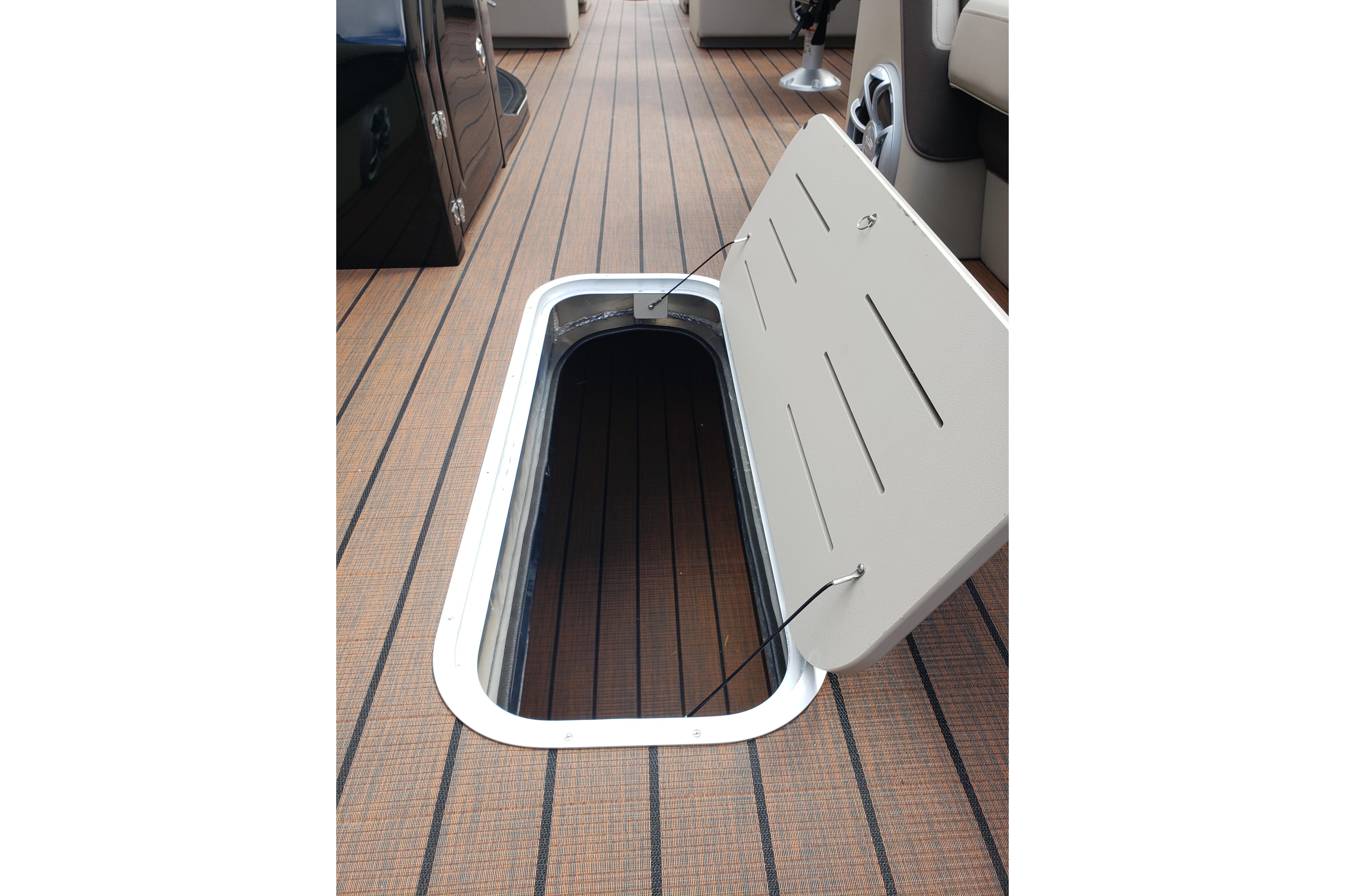 Open storage compartment on 2026 Bentley Pontoons Elite 253 QSB deck.