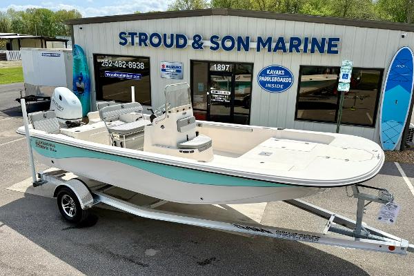 2025 Carolina Skiff 21 LS boat on trailer at Stroud & Son Marine dealership.