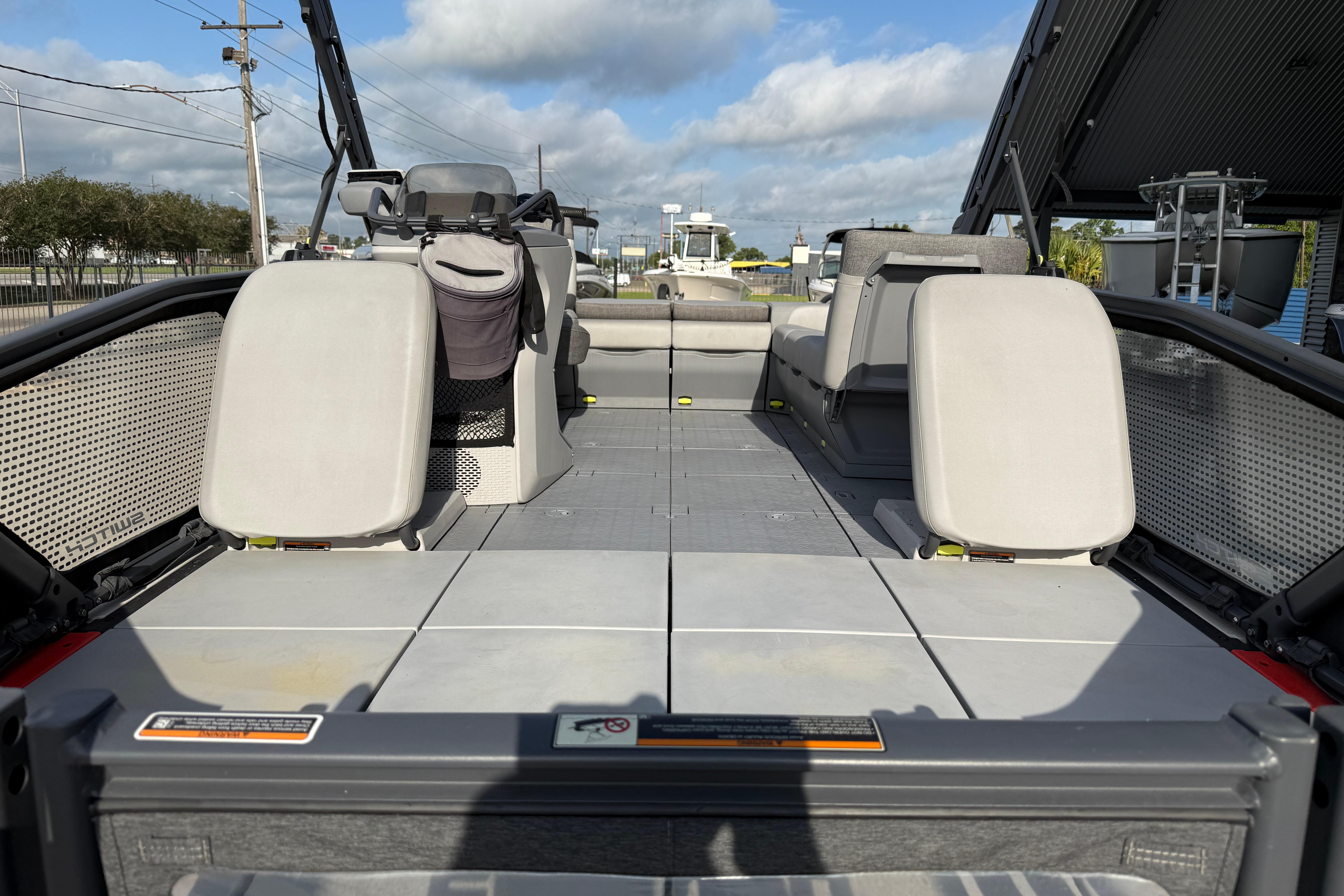2023 Sea-Doo Switch Sport 18 interior with seating and open deck layout.