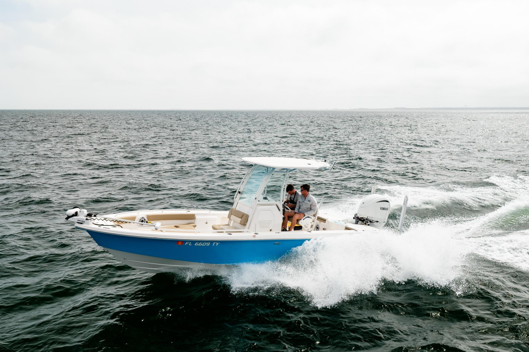 2023 Everglades 243 Center Console boat cruising on open water.