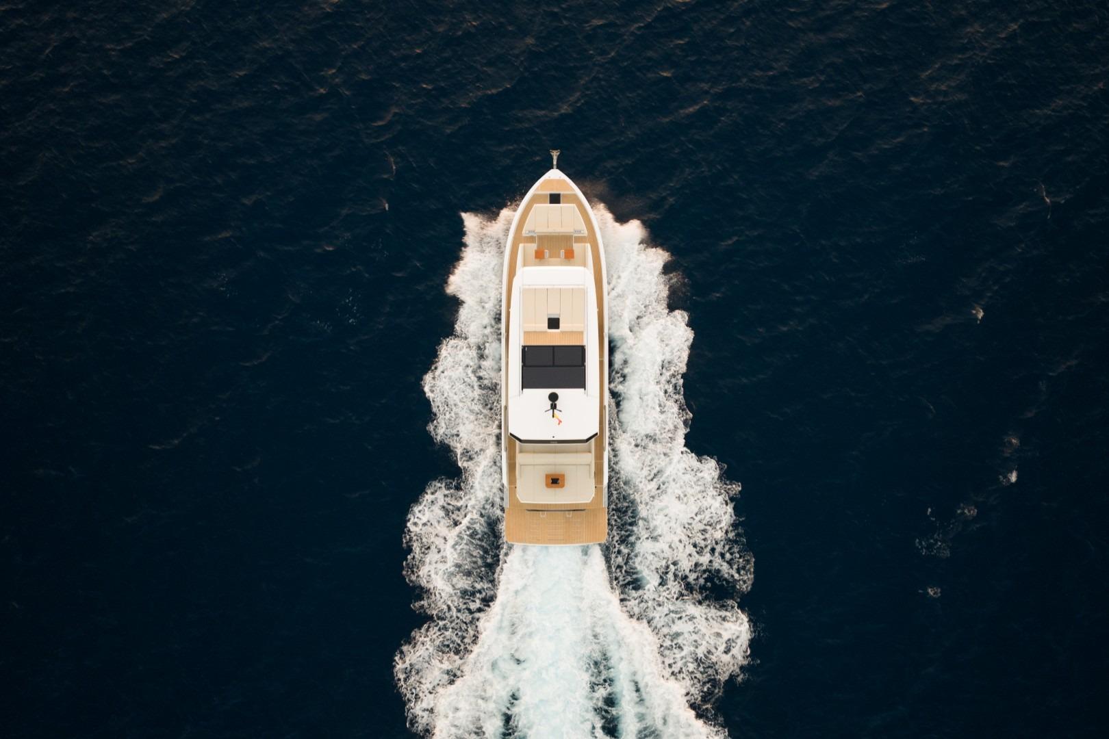 Aerial view of 2026 De Antonio Yachts D60 cruising on open sea.
