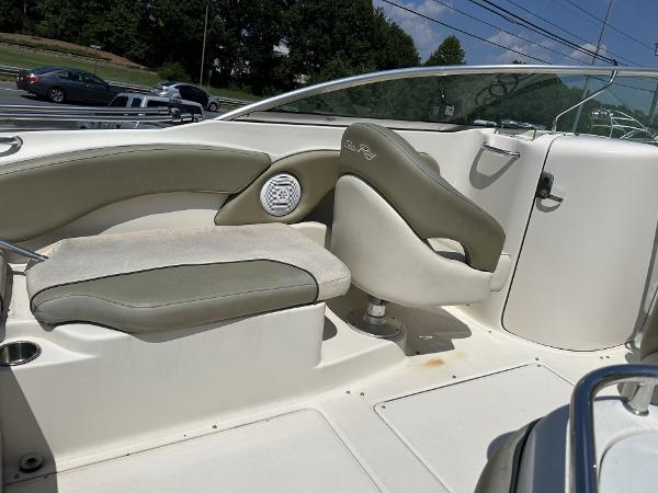 2005 Sea Ray 240 SD boat interior with beige seating and speaker.