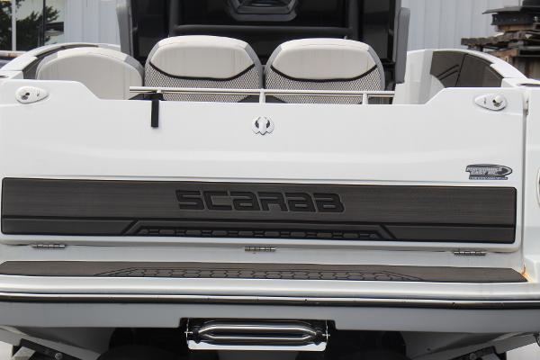 2023 Scarab 255 Open ID boat rear view with logo and seating.