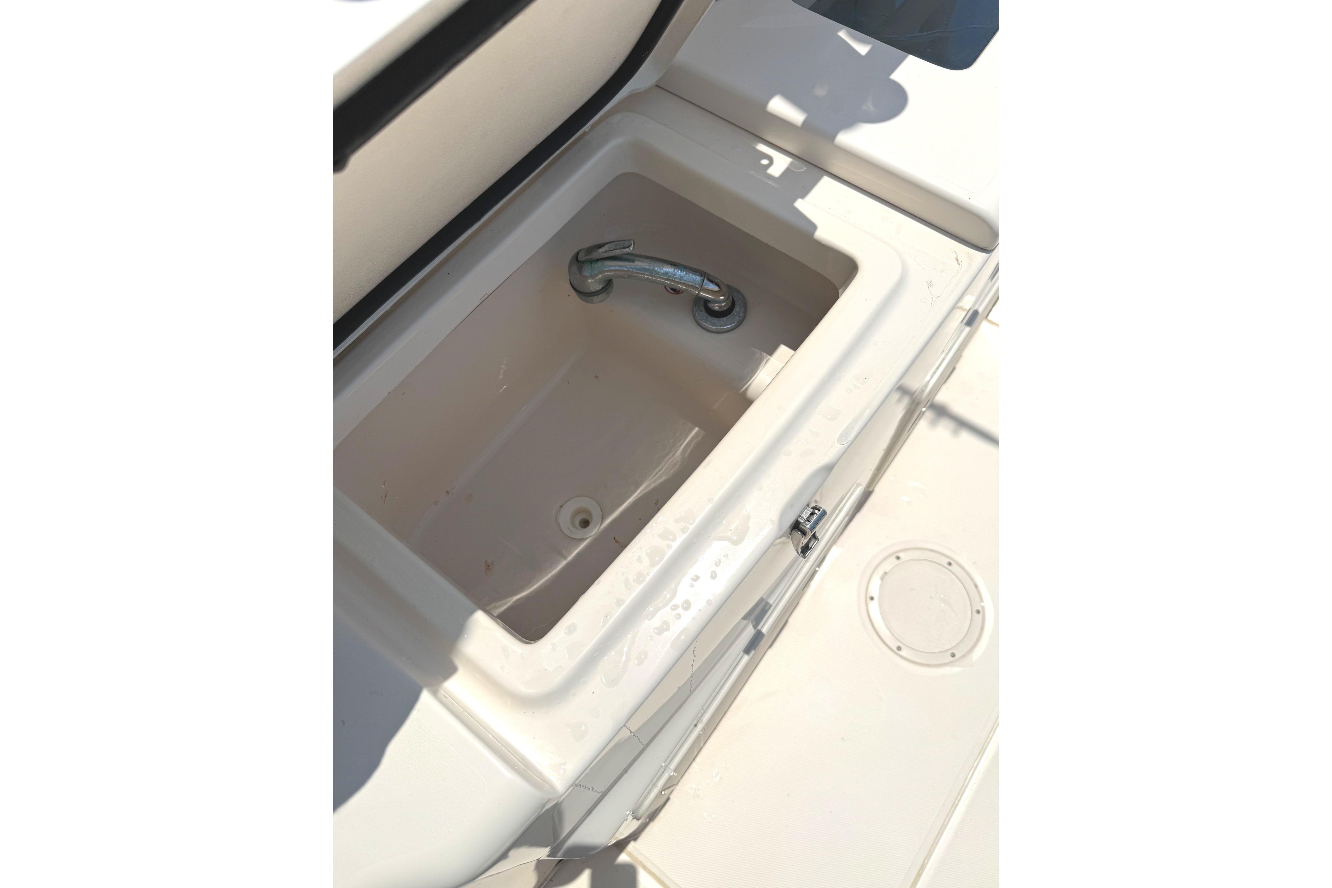 Open storage compartment on 2018 Grady-White Canyon 306 boat deck.