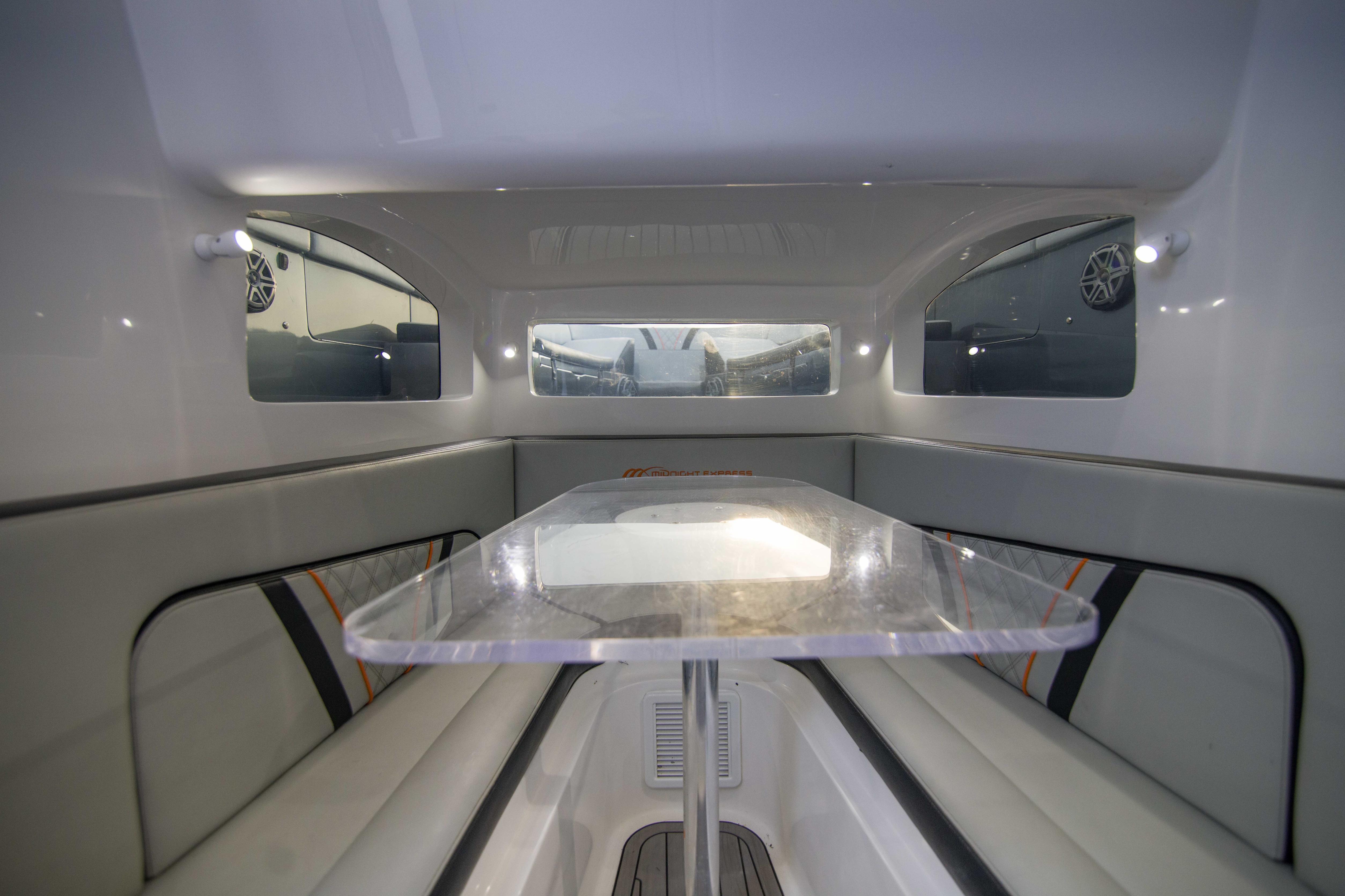 Interior of 2019 Midnight Express 43 Open boat with sleek seating and table.