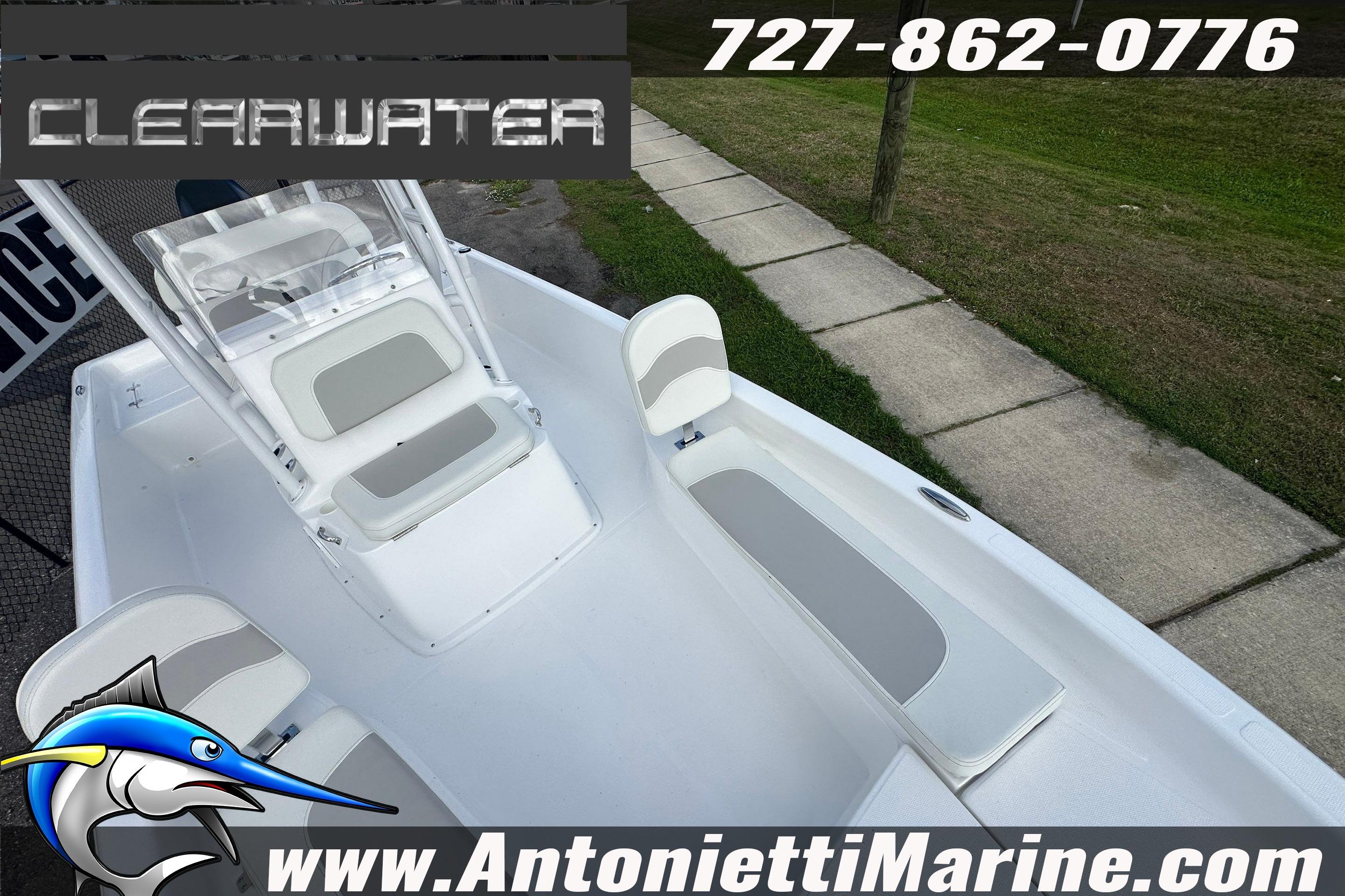 2026 Clearwater 2100 Bay boat interior with seating, contact info, and website details.