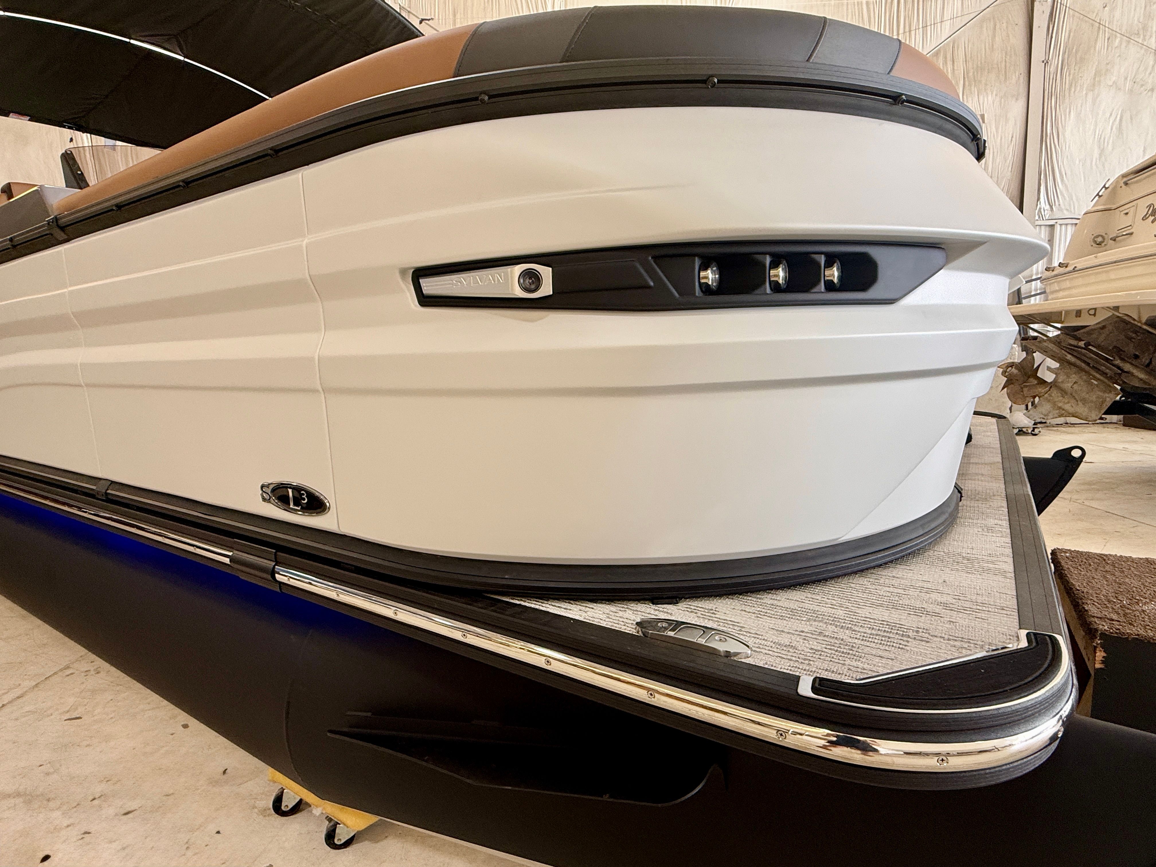 Close-up of the bow of a 2026 Sylvan L3 ULZ DH boat in a warehouse.
