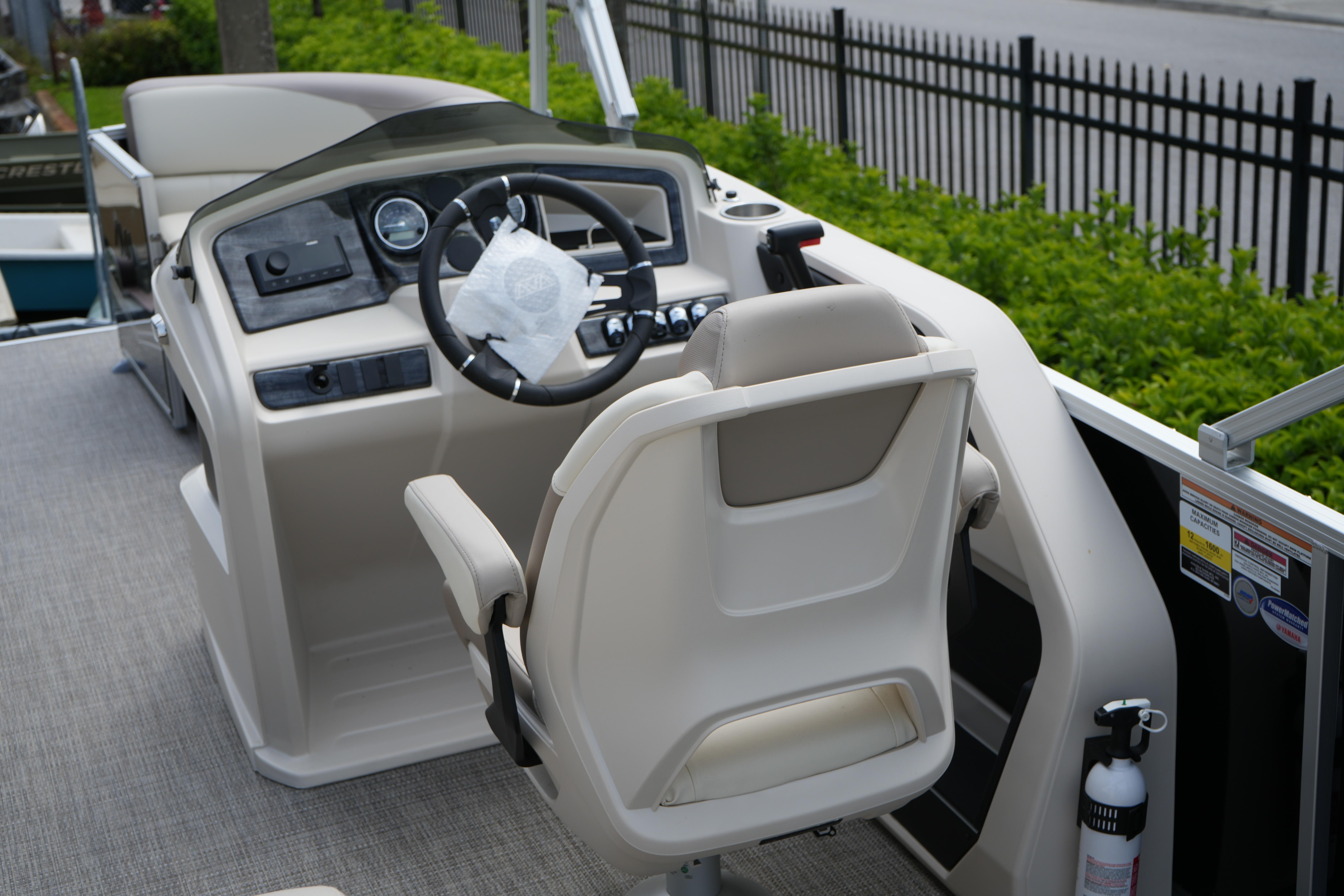 2026 Avalon LSZ Rear Fish boat interior with steering console and captain's chair.