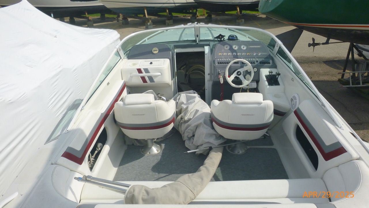 Interior view of a 1992 Powerquest 270 Laser with two white seats.