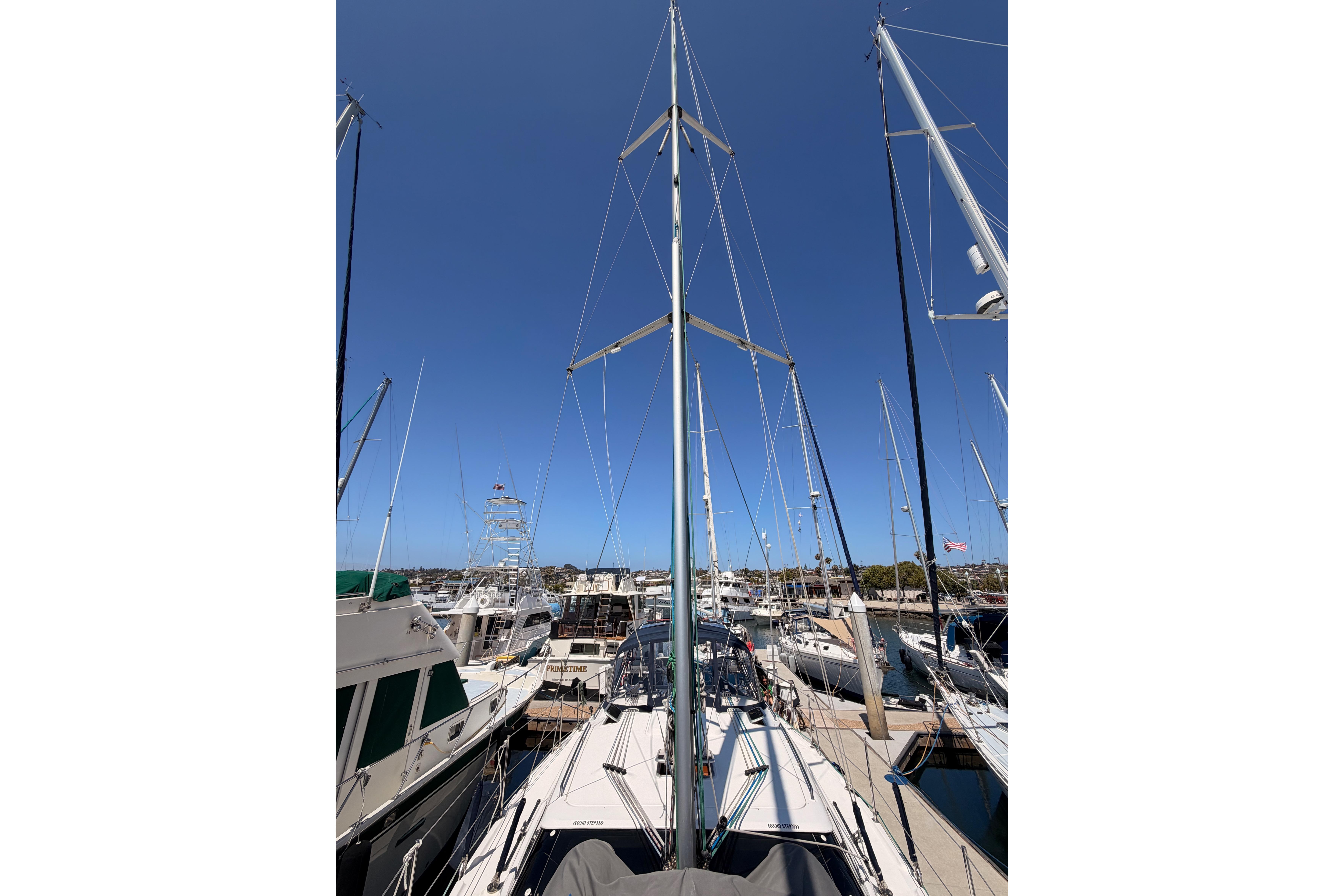 Sailboats docked at a marina, featuring a 2008 Hunter 45 Deck Salon.