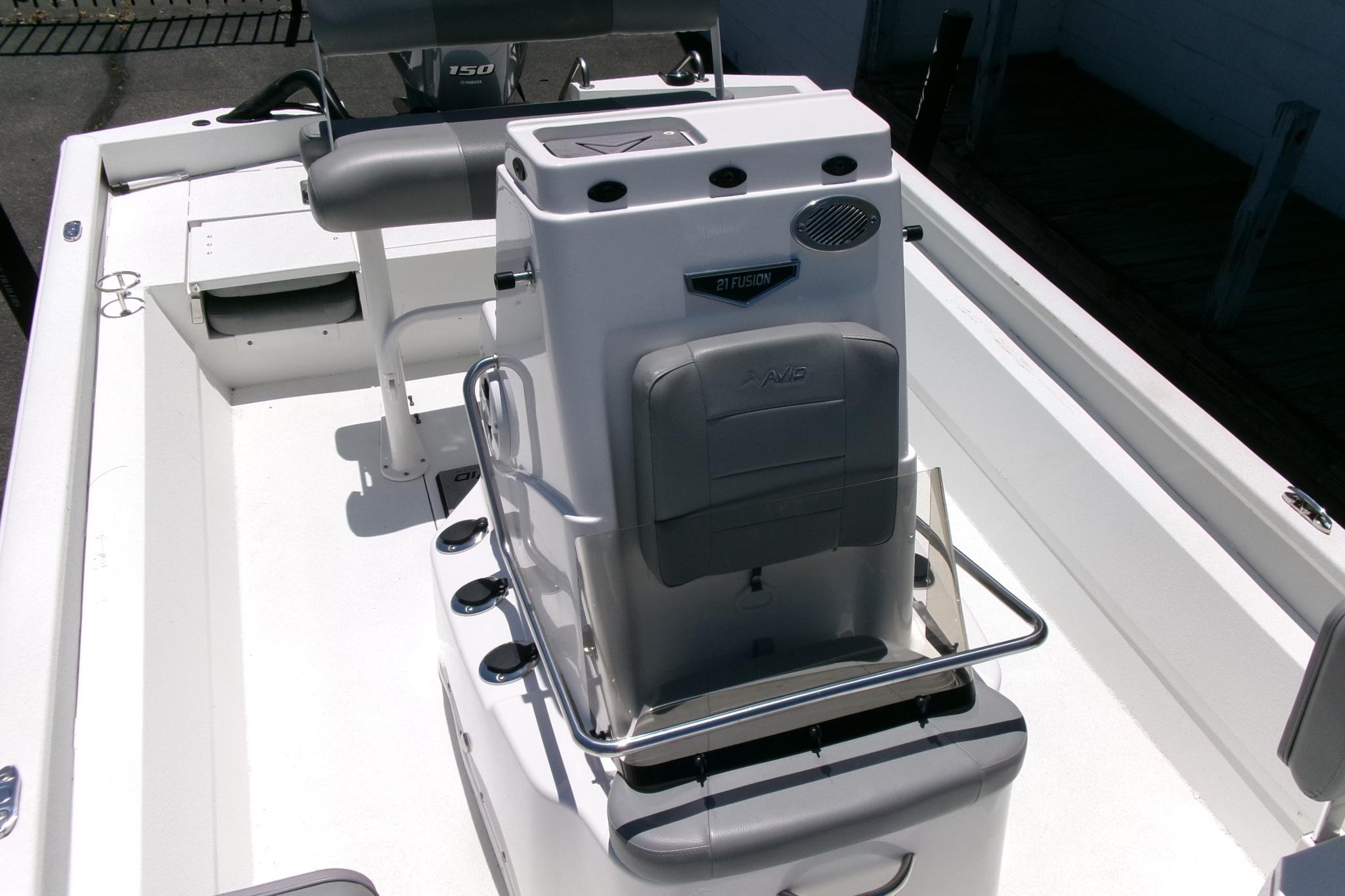 Avid 21 Fusion 2022 boat interior with seating and control console.