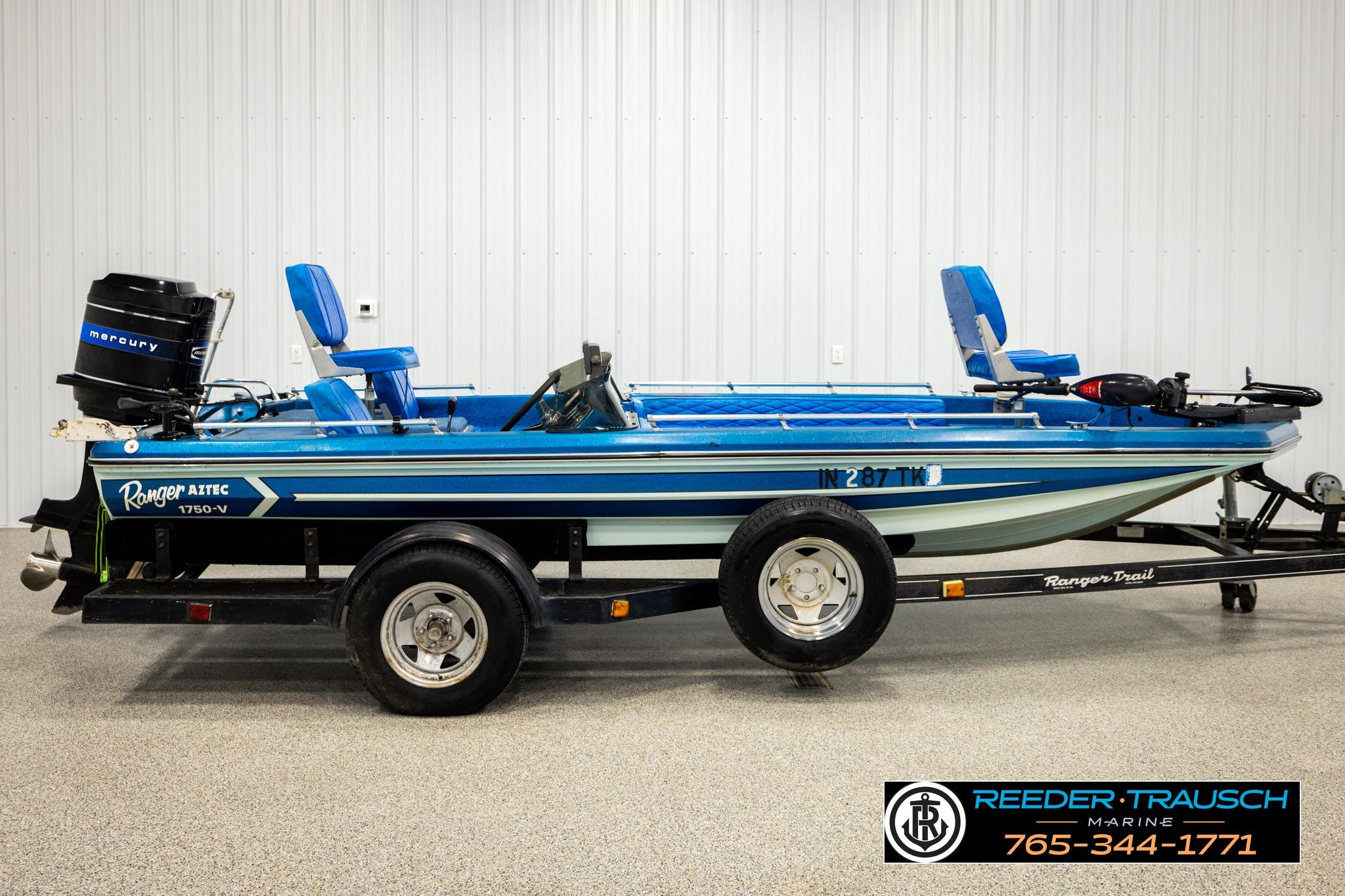 1980 Ranger 175 VS boat with Mercury engine on trailer in showroom.
