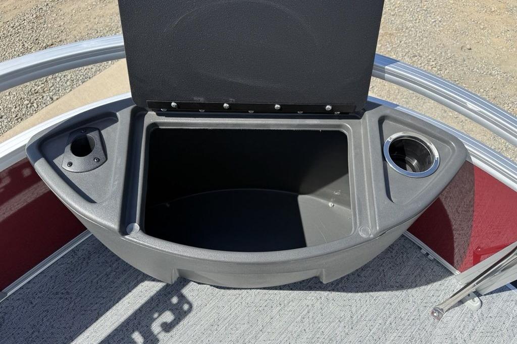Storage compartment on 2026 Sun Tracker Bass Buggy 18 DLX pontoon boat, featuring cup holders.