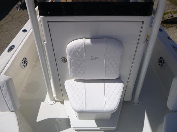 2024 Ranger 2360 Bay boat with white cushioned seat and storage compartment.
