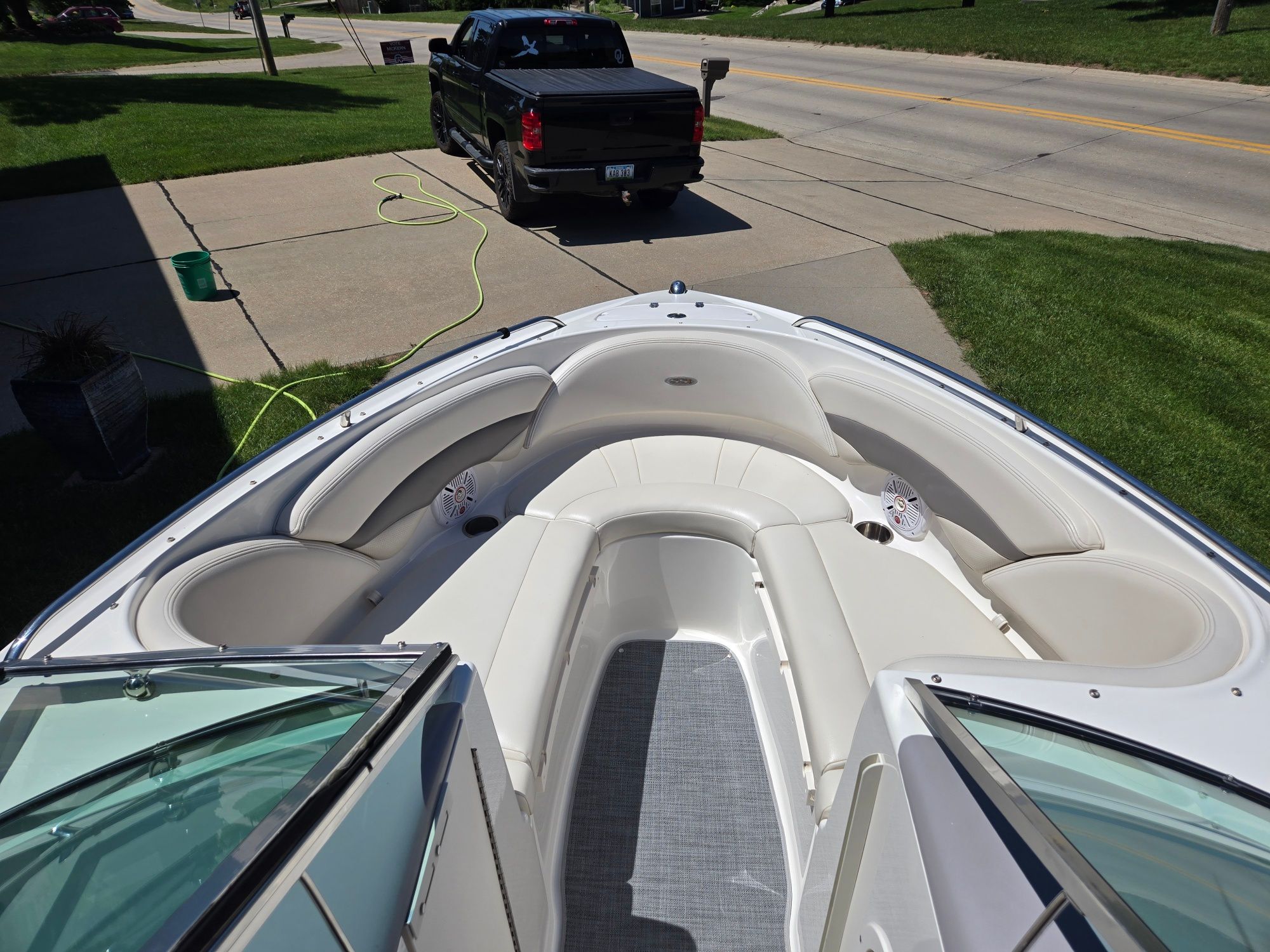The image shows the bow of a 2005 Chaparral 220 SSi boat with white seating.