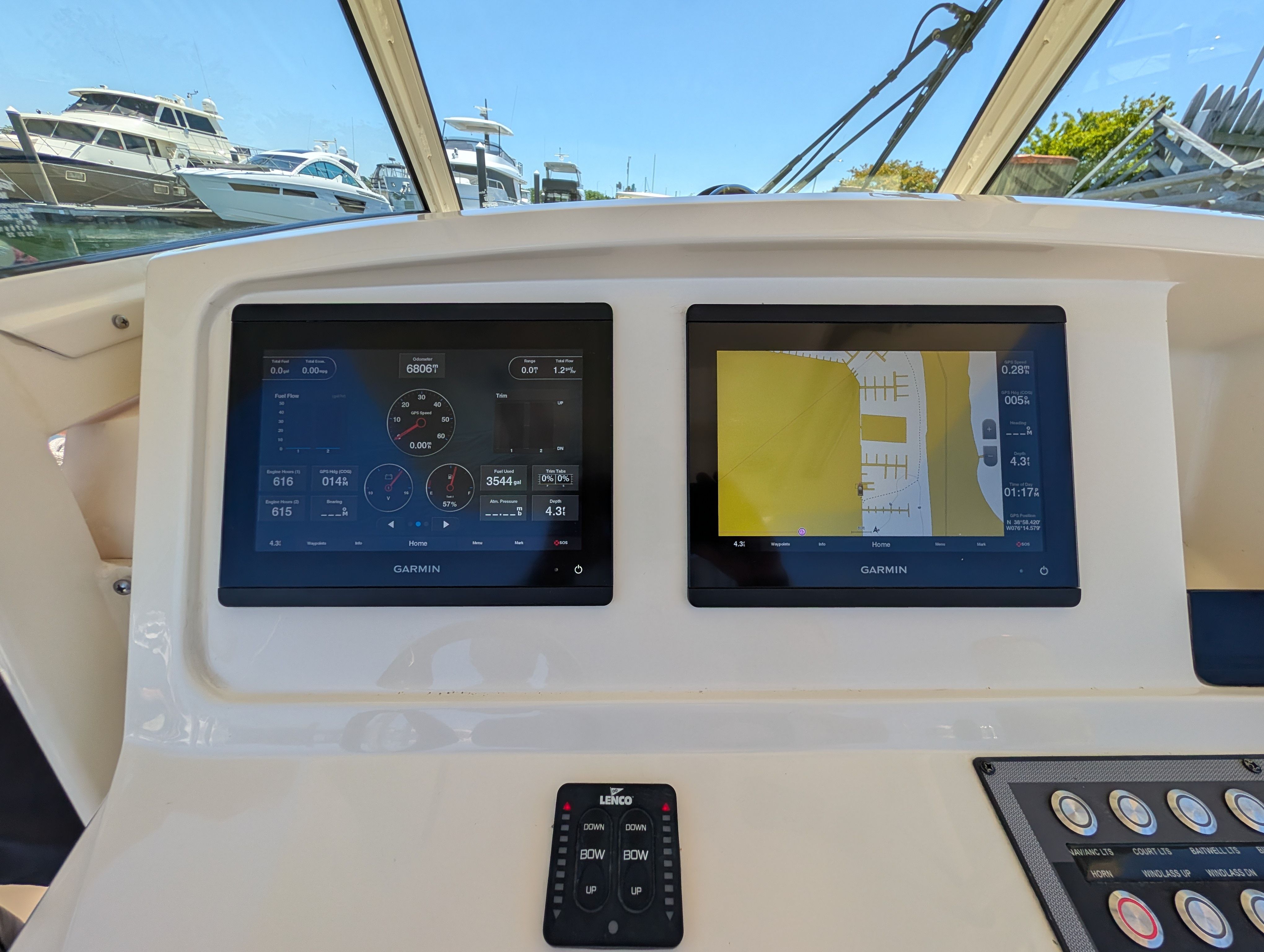 Scout 255 LXF 2020 boat console with Garmin displays at the marina.