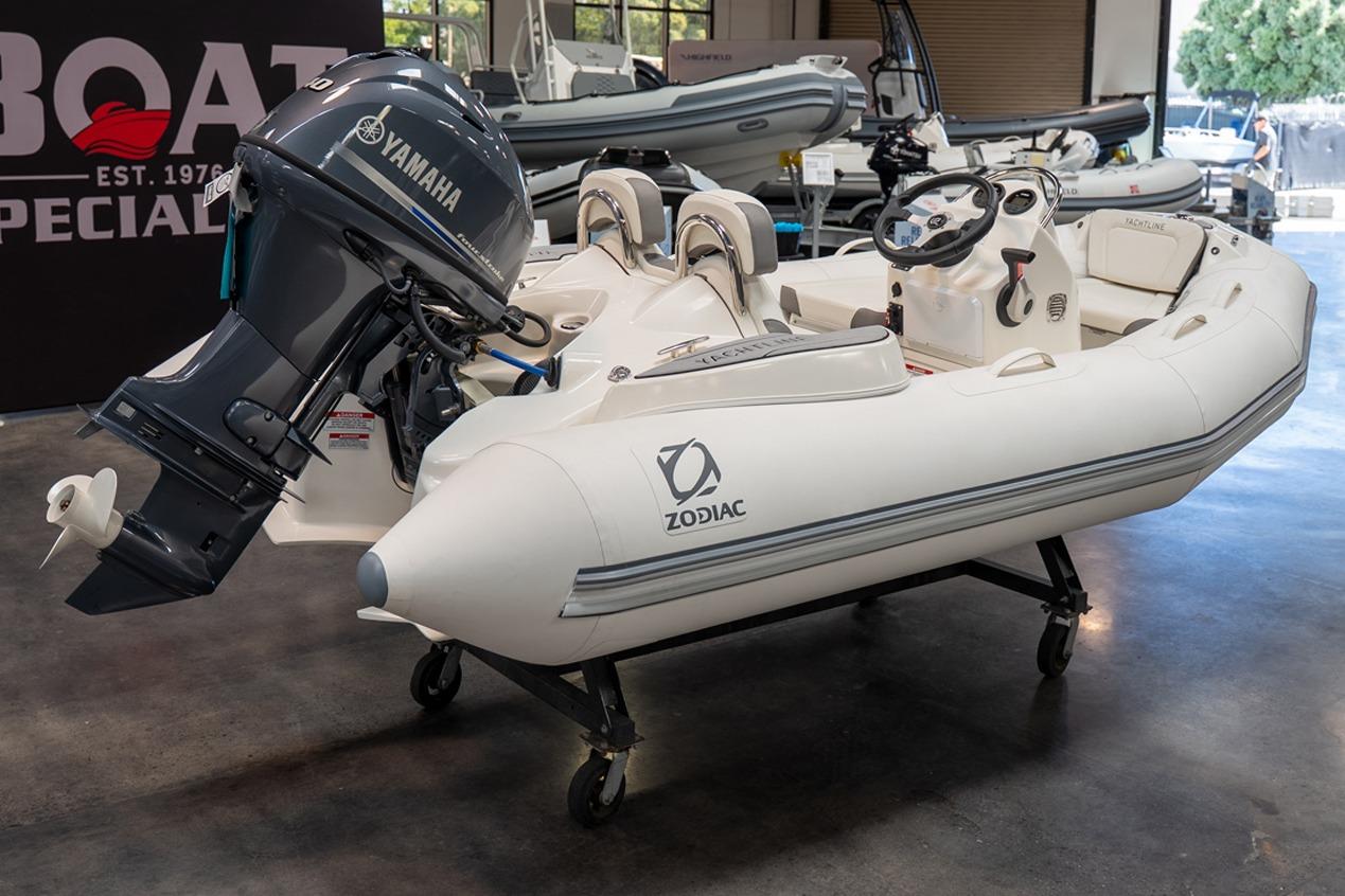 2026 Zodiac Yachtline 360 inflatable boat with Yamaha outboard motor in showroom display.